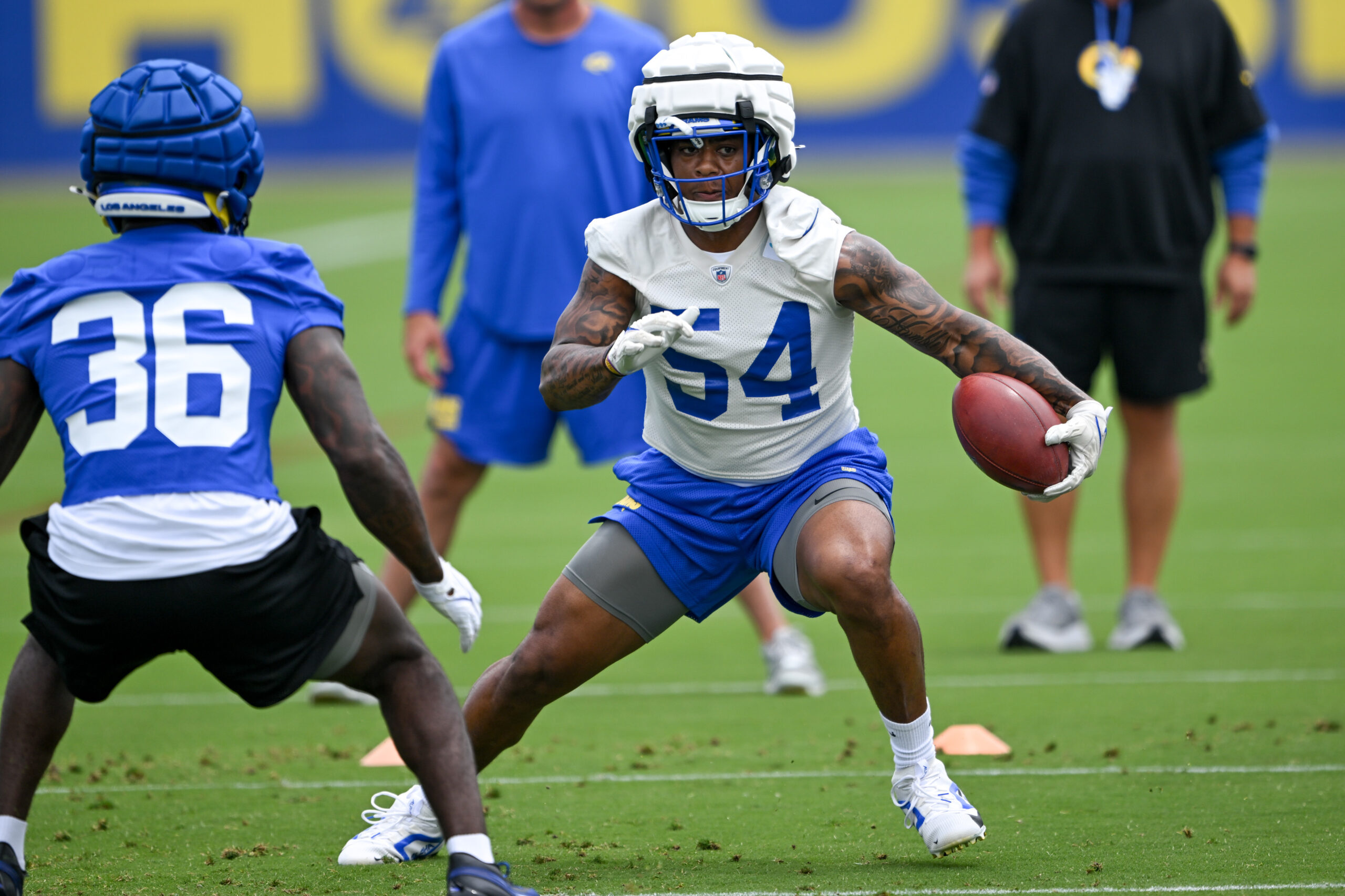 Rams linebacker Chris Paul Jr., right, goes through drills during...