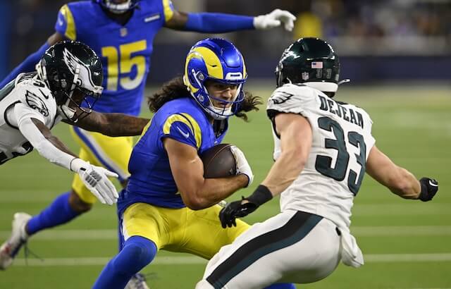 Nov 24, 2024; Inglewood, California, USA; Los Angeles Rams wide receiver Puka Nacua (17) runs after a catch against Philadelphia Eagles cornerback Cooper DeJean (33) and cornerback Isaiah Rodgers (left) in pursuit during the second half at SoFi Stadium. Mandatory Credit: Alex Gallardo-Imagn Images Puka Nacua, Rams, Eagles