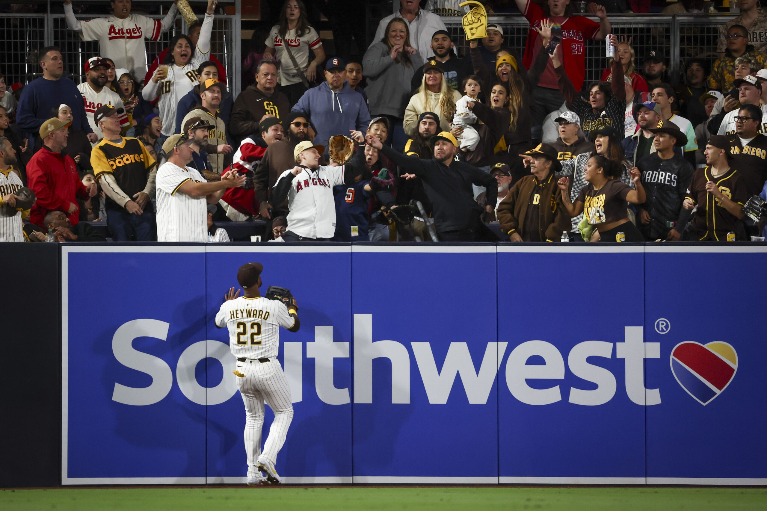 San Diego Padres left fielder Jason Heyward watches as a...