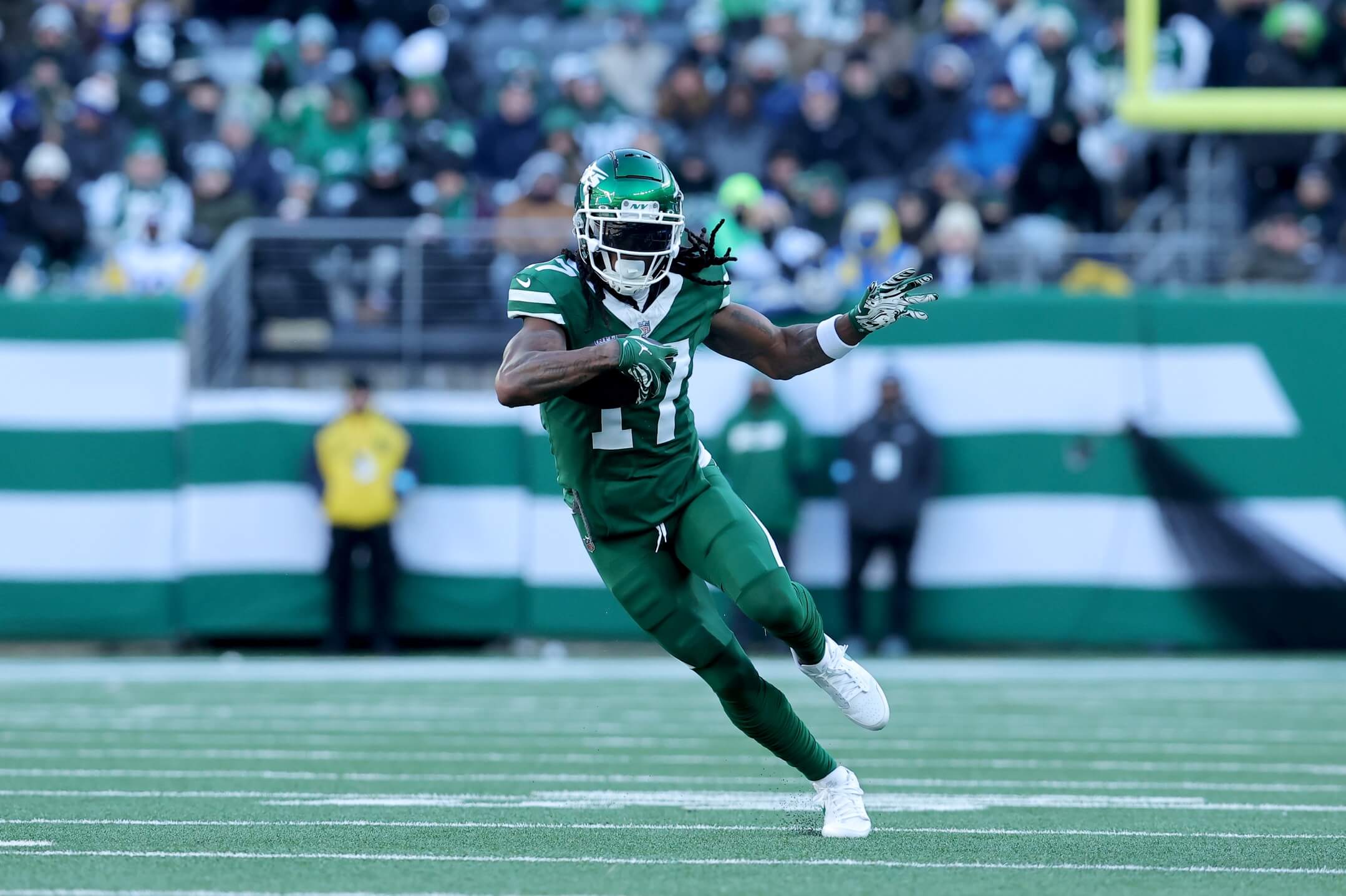Dec 22, 2024; East Rutherford, New Jersey, USA; New York Jets wide receiver Davante Adams (17) runs with the ball against the Los Angeles Rams during the second quarter at MetLife Stadium. Mandatory Credit: Brad Penner-Imagn Images