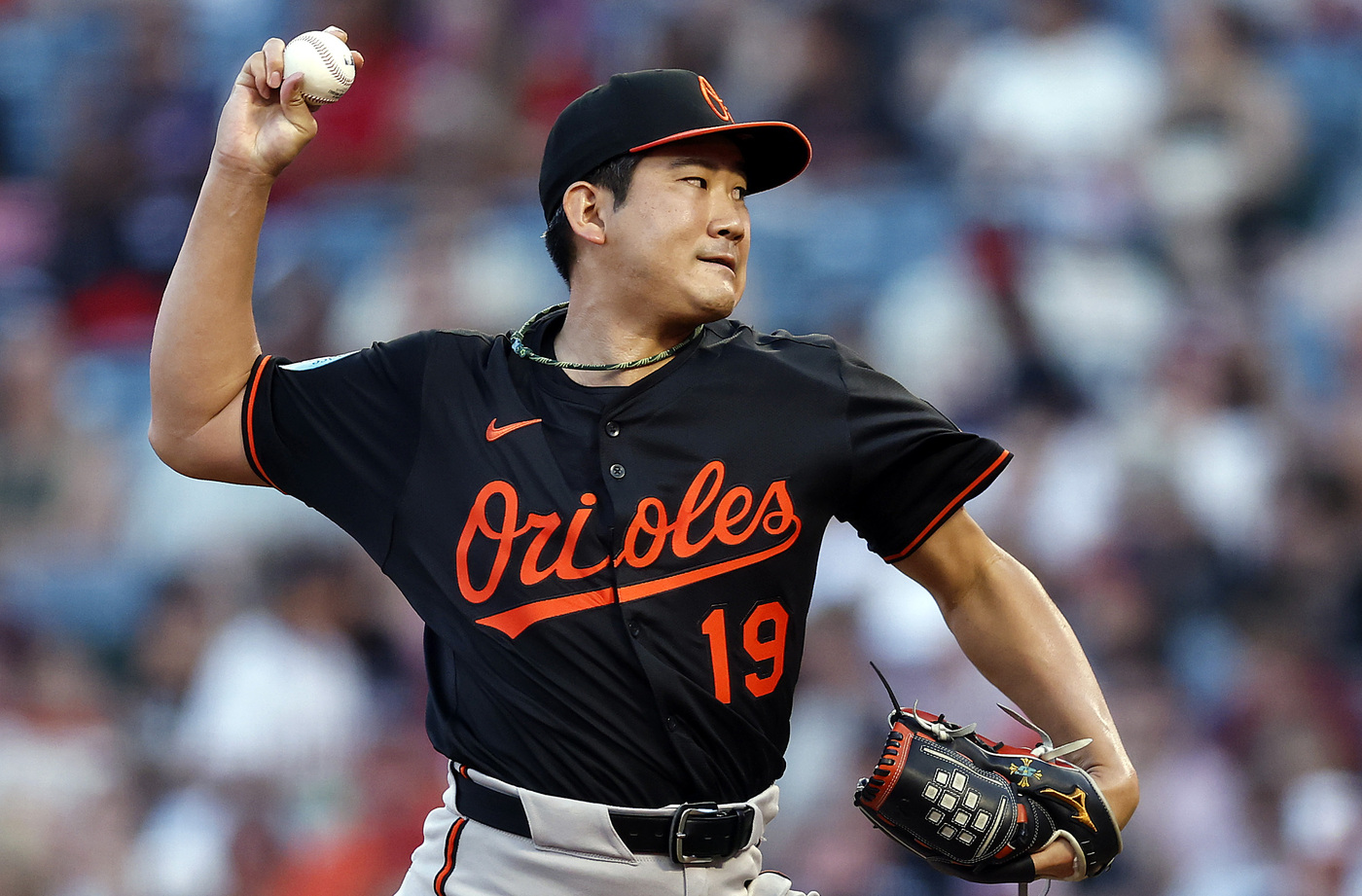 Baltimore Orioles starting pitcher Tomoyuki Sugano throws to the plate...