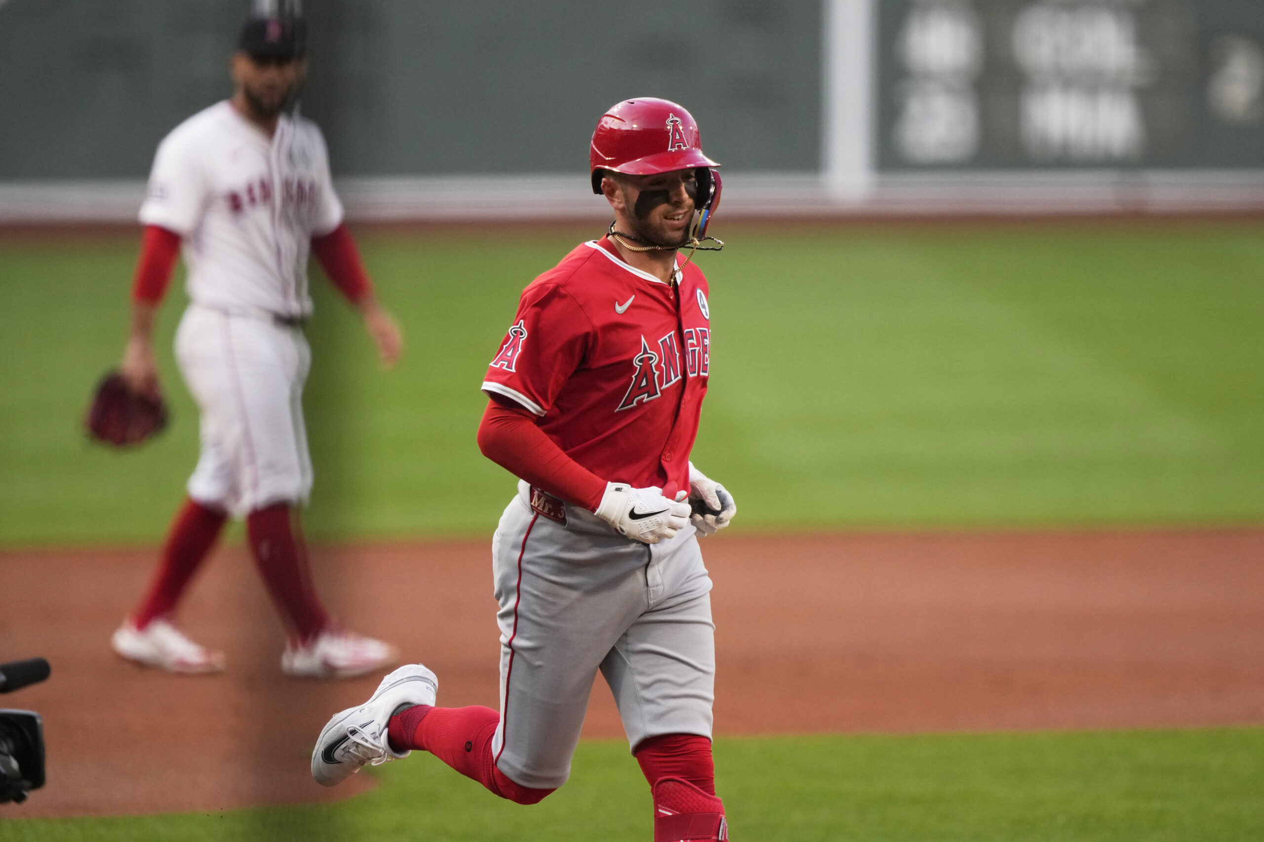 The Angels’ Zach Neto rounds the bases after hitting a...