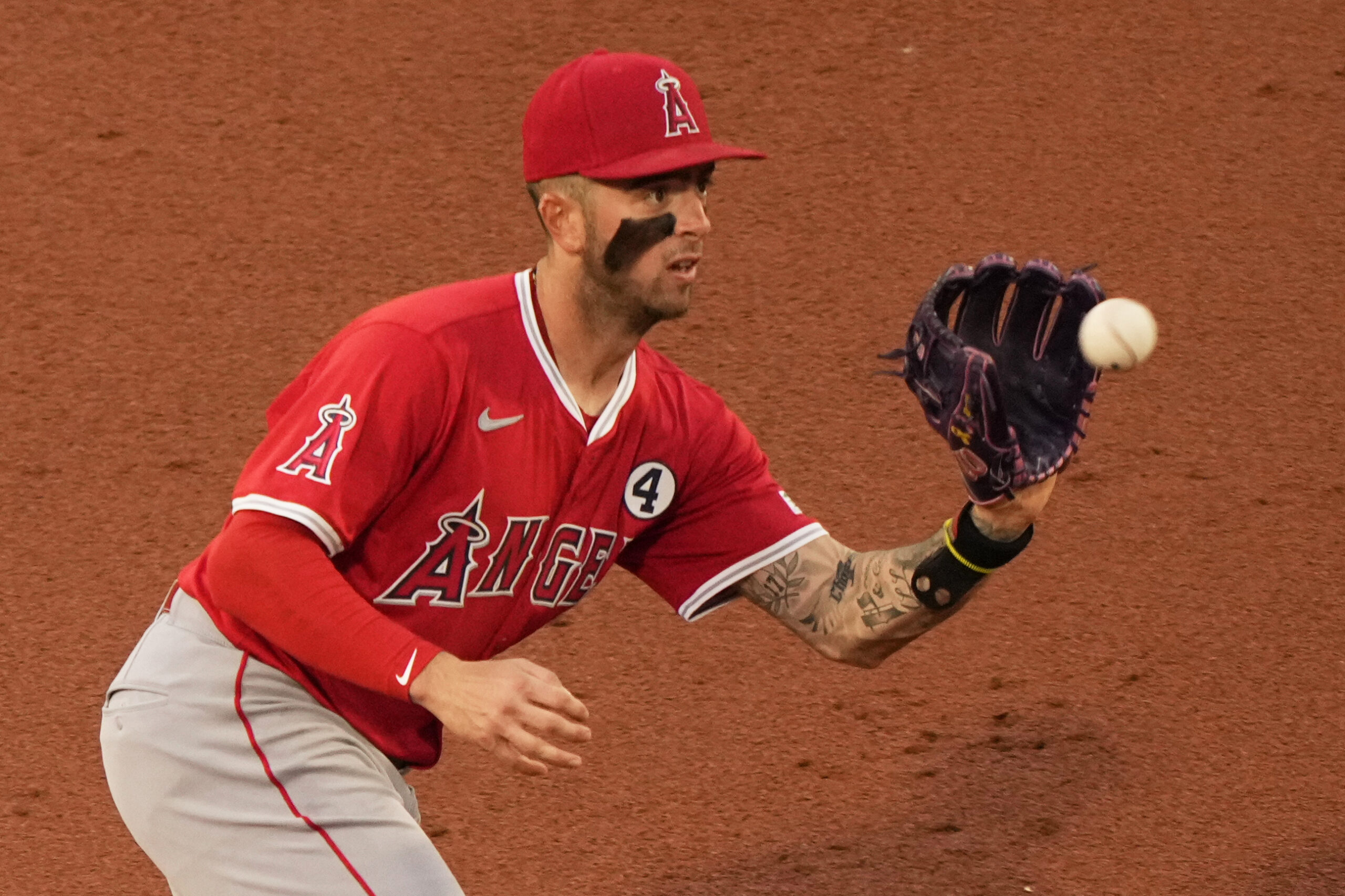 Angels shortstop Zach Neto fields a ball during the second...