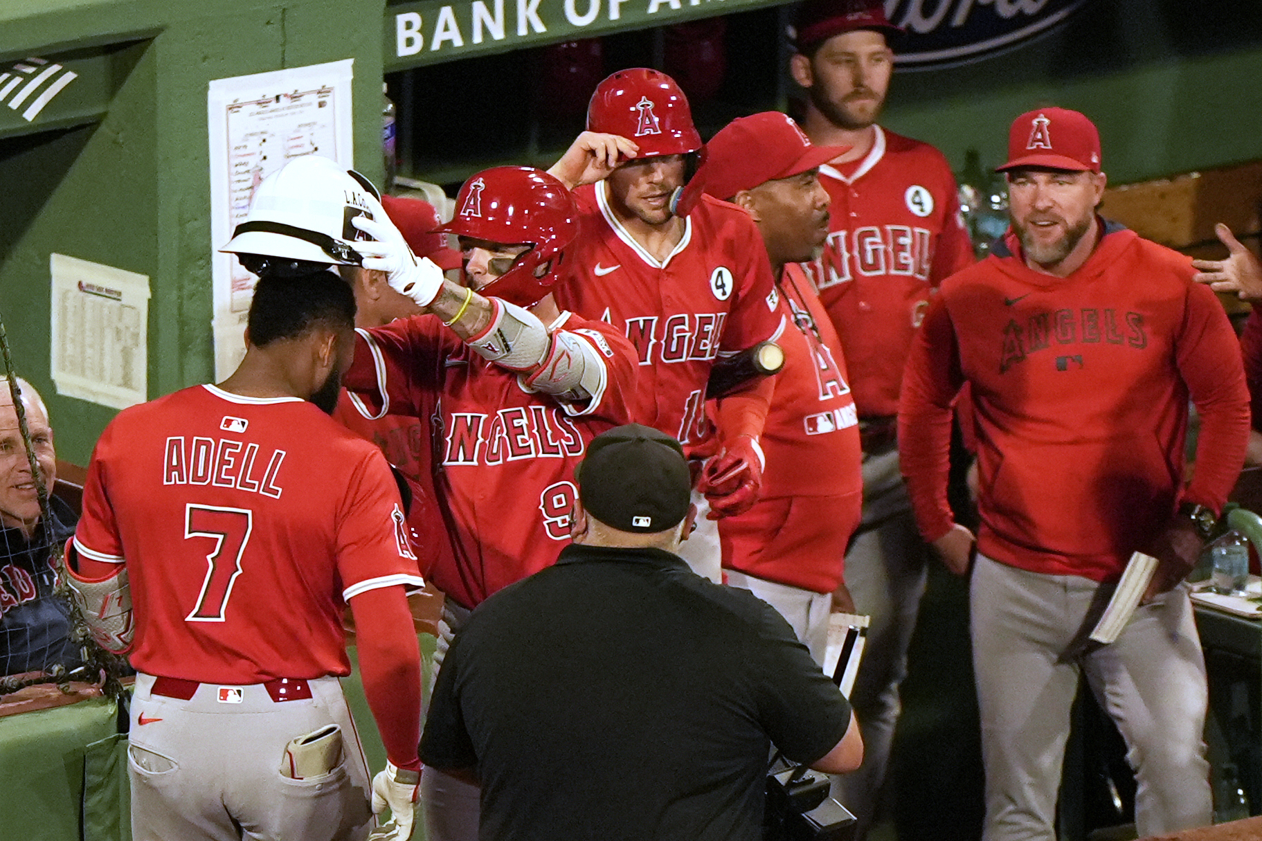 The Angels’ Jo Adell (7) has the fire fighter helmet...