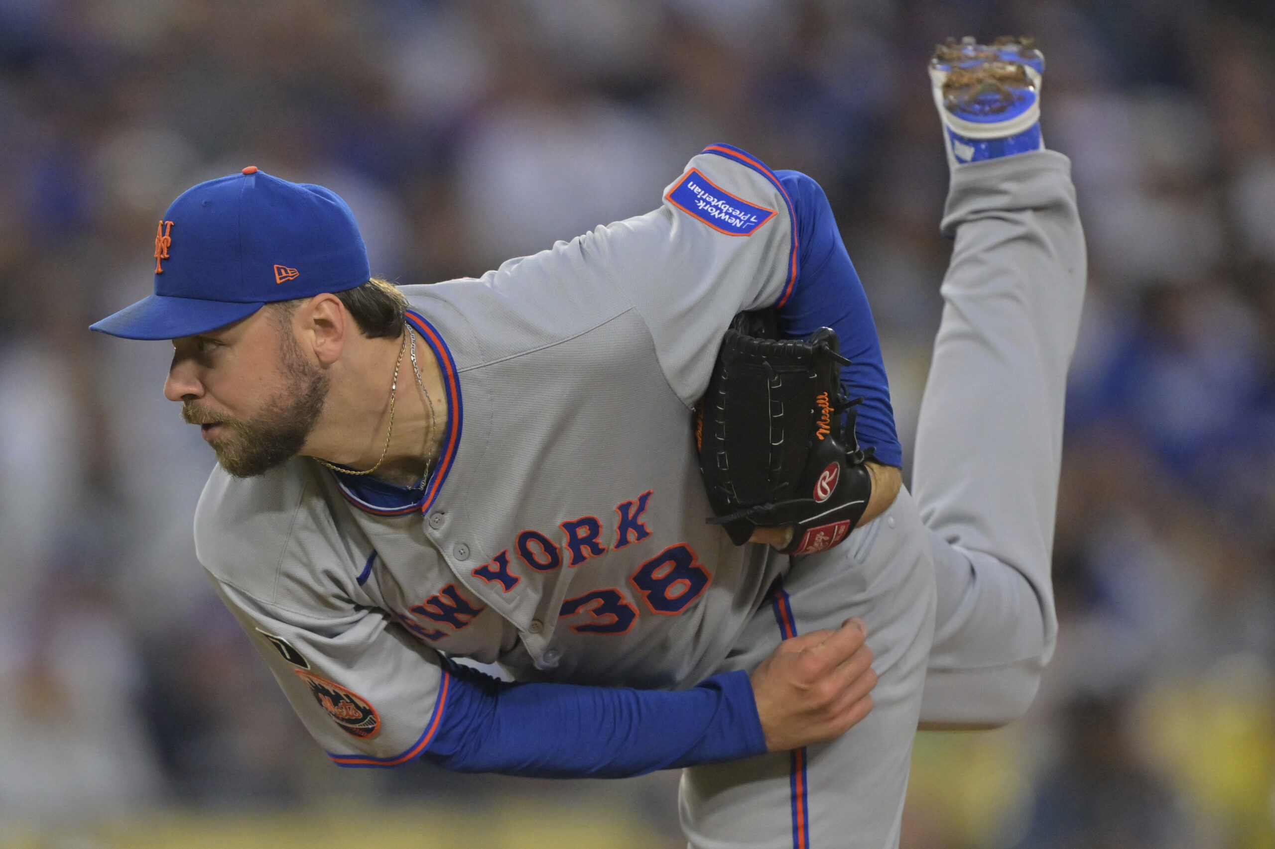 New York Mets starting pitcher Tylor Megill throws to the...