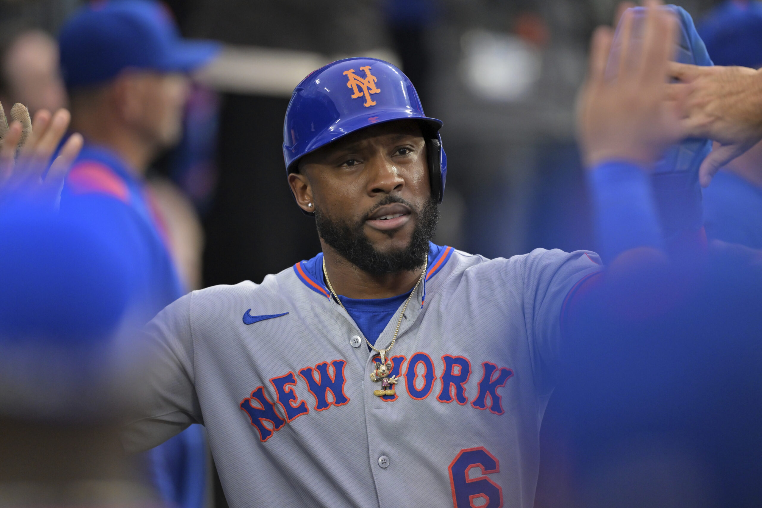 The New York Mets’ Starling Marte is greeted in the...