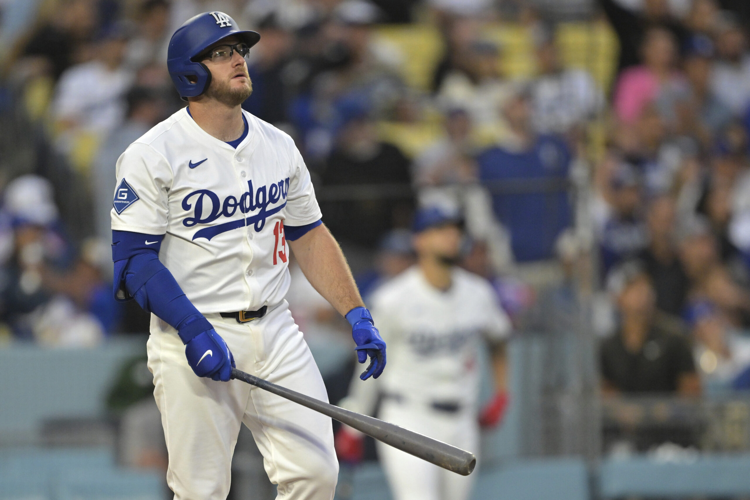 The Dodgers’ Max Muncy watches the flight of his two-run...
