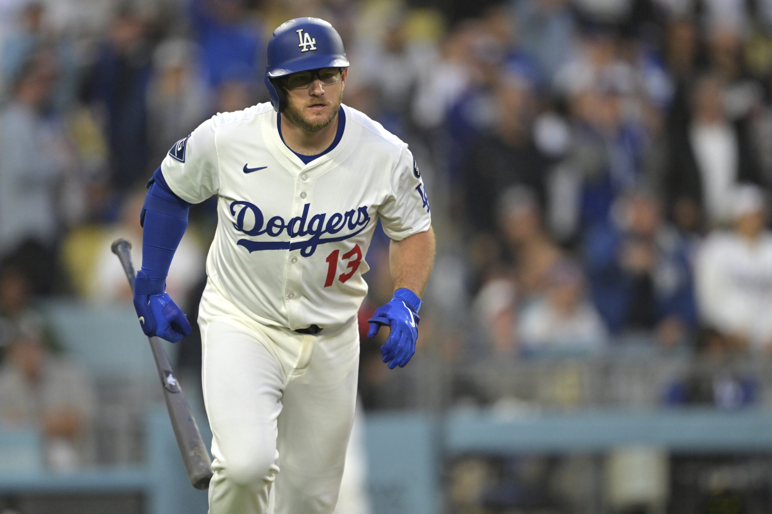 The Dodgers’ Max Muncy begins to run the bases after...