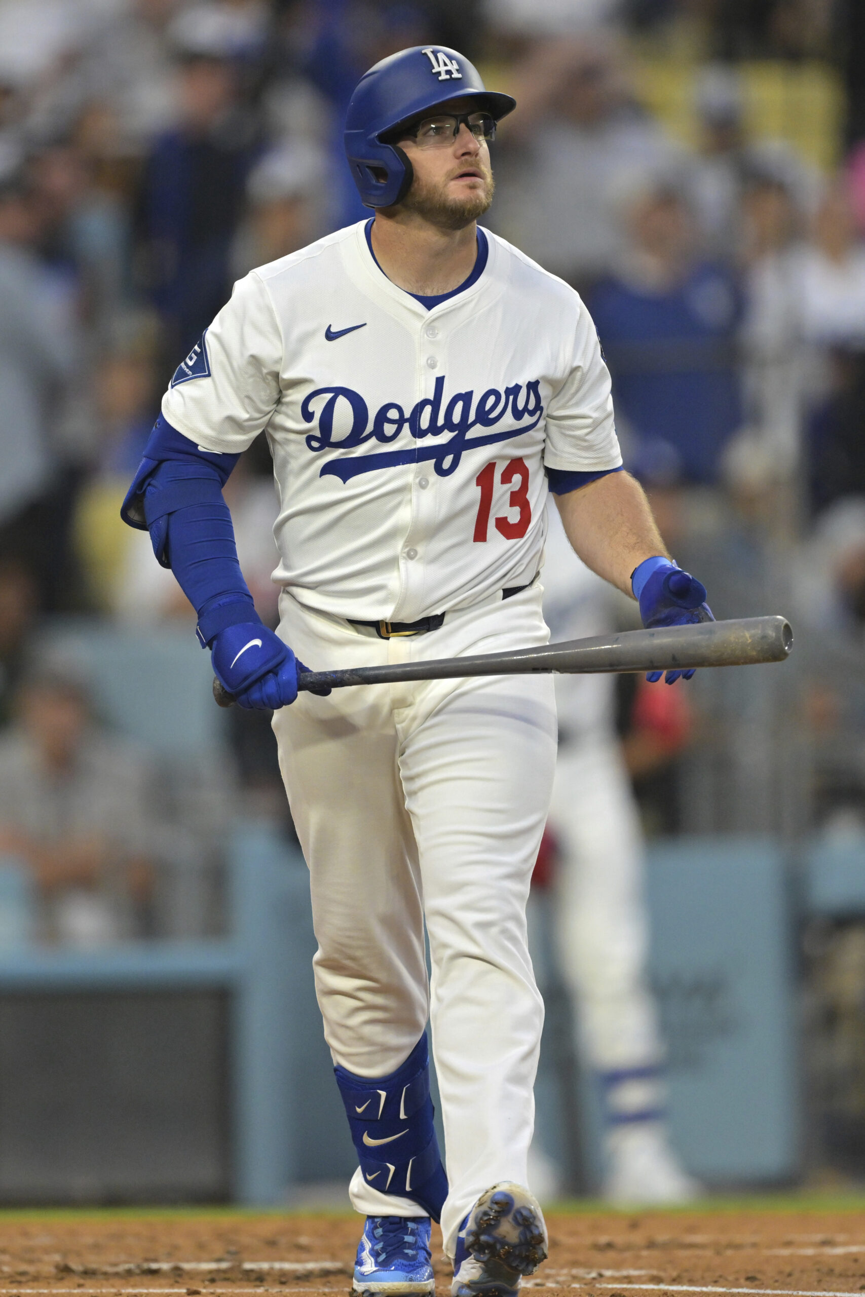 The Dodgers’ Max Muncy watches the flight of his two-run...