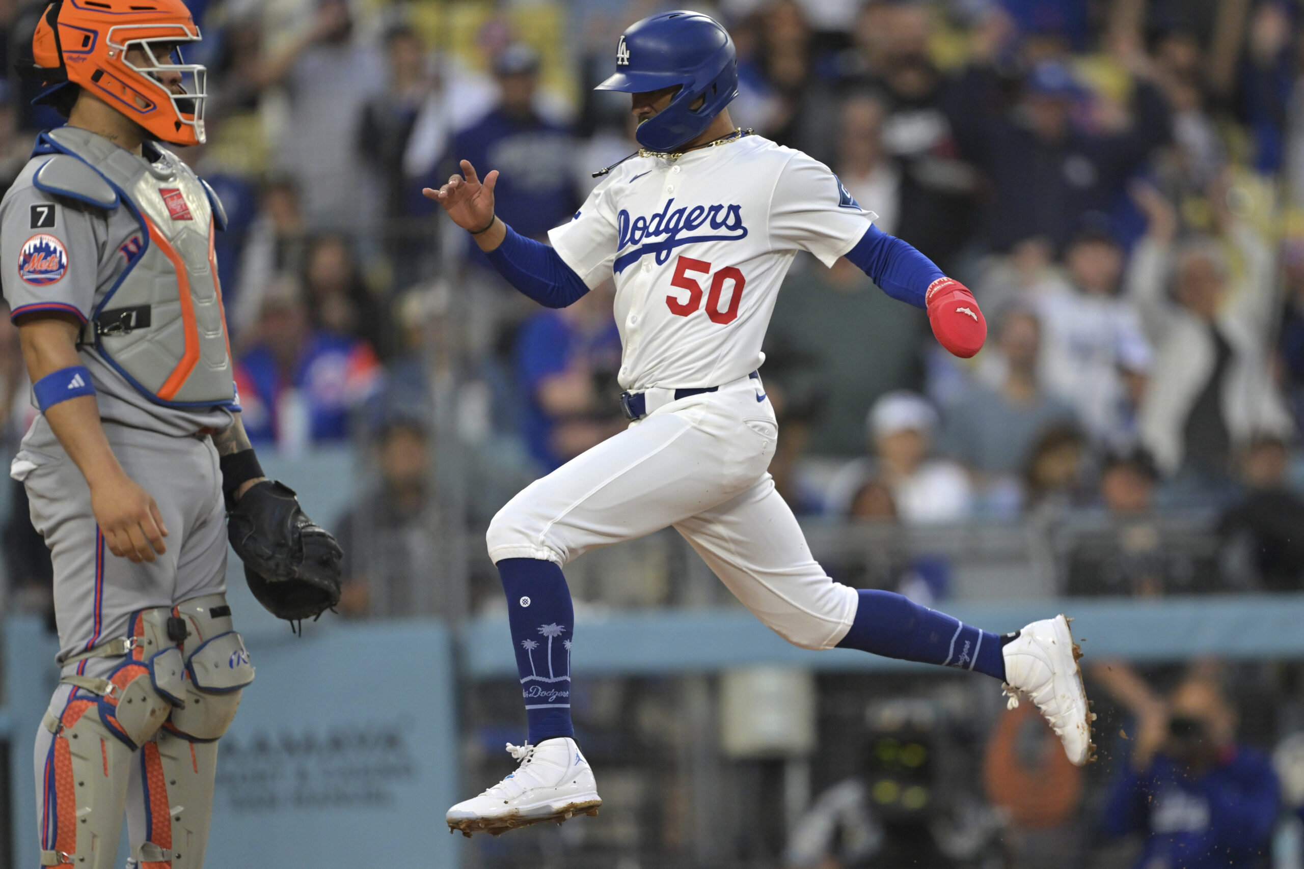 Dodgers star Mookie Betts runs home to score past New...