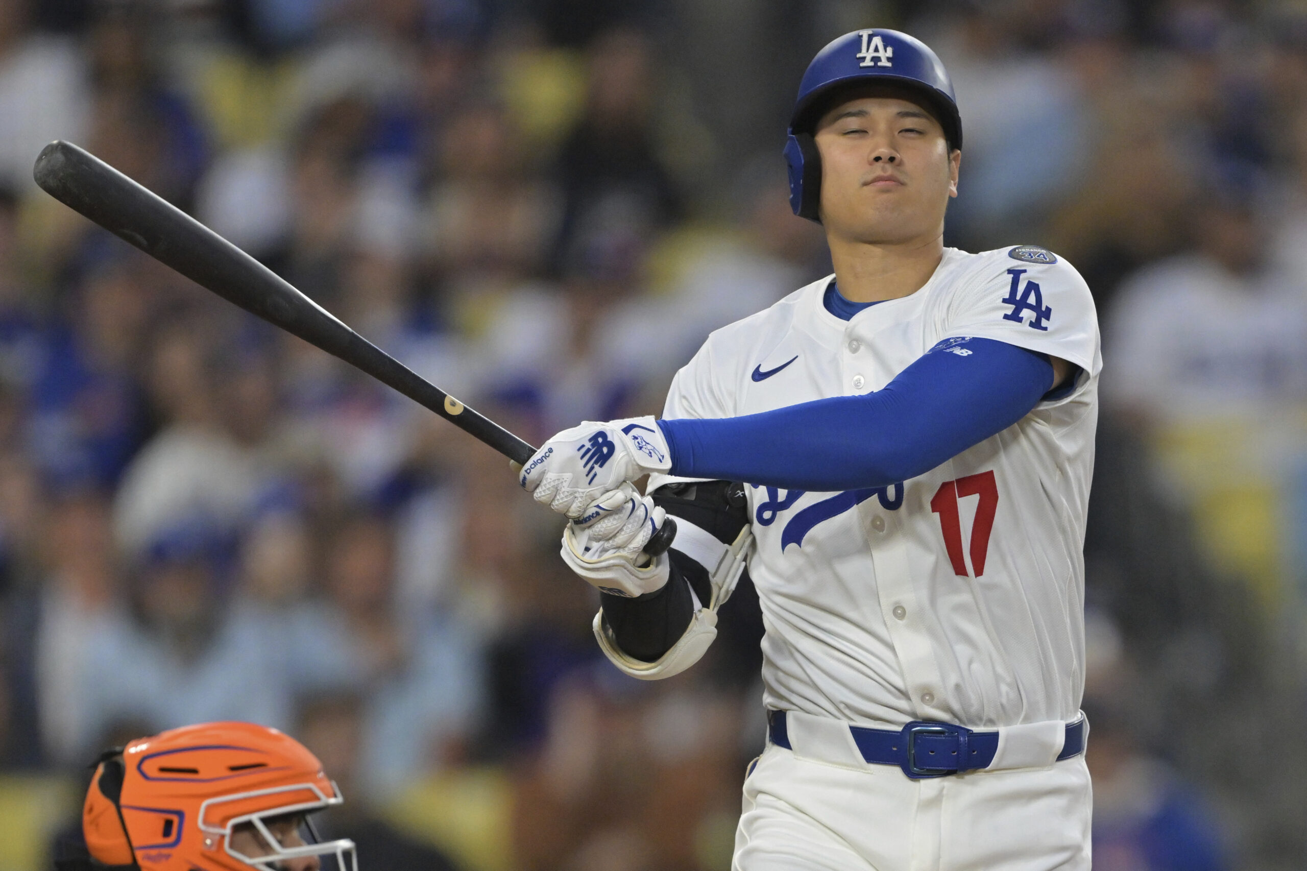 Dodgers star Shohei Ohtani follows through on a swing during...