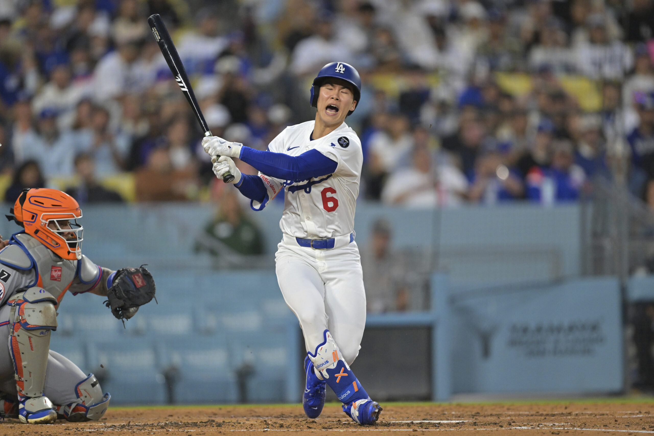The Dodgers’ Hyeseong Kim reacts after fouling a ball off...