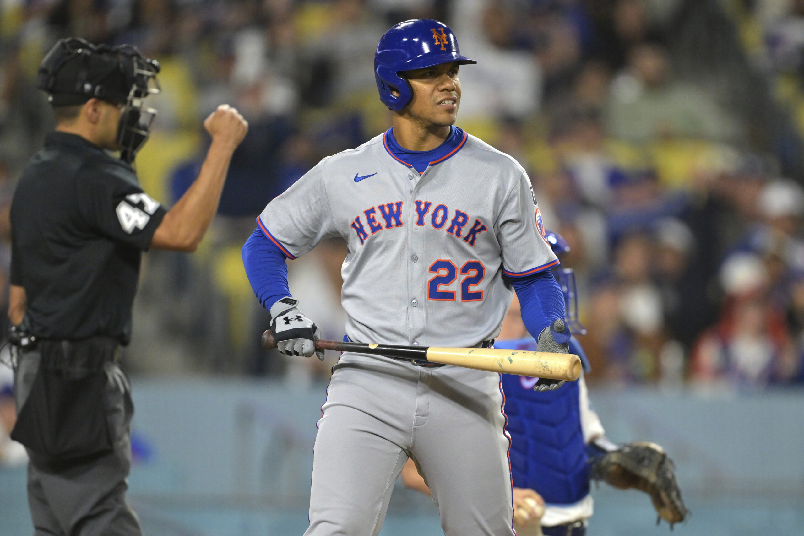 New York Mets star Juan Soto walks back to the...
