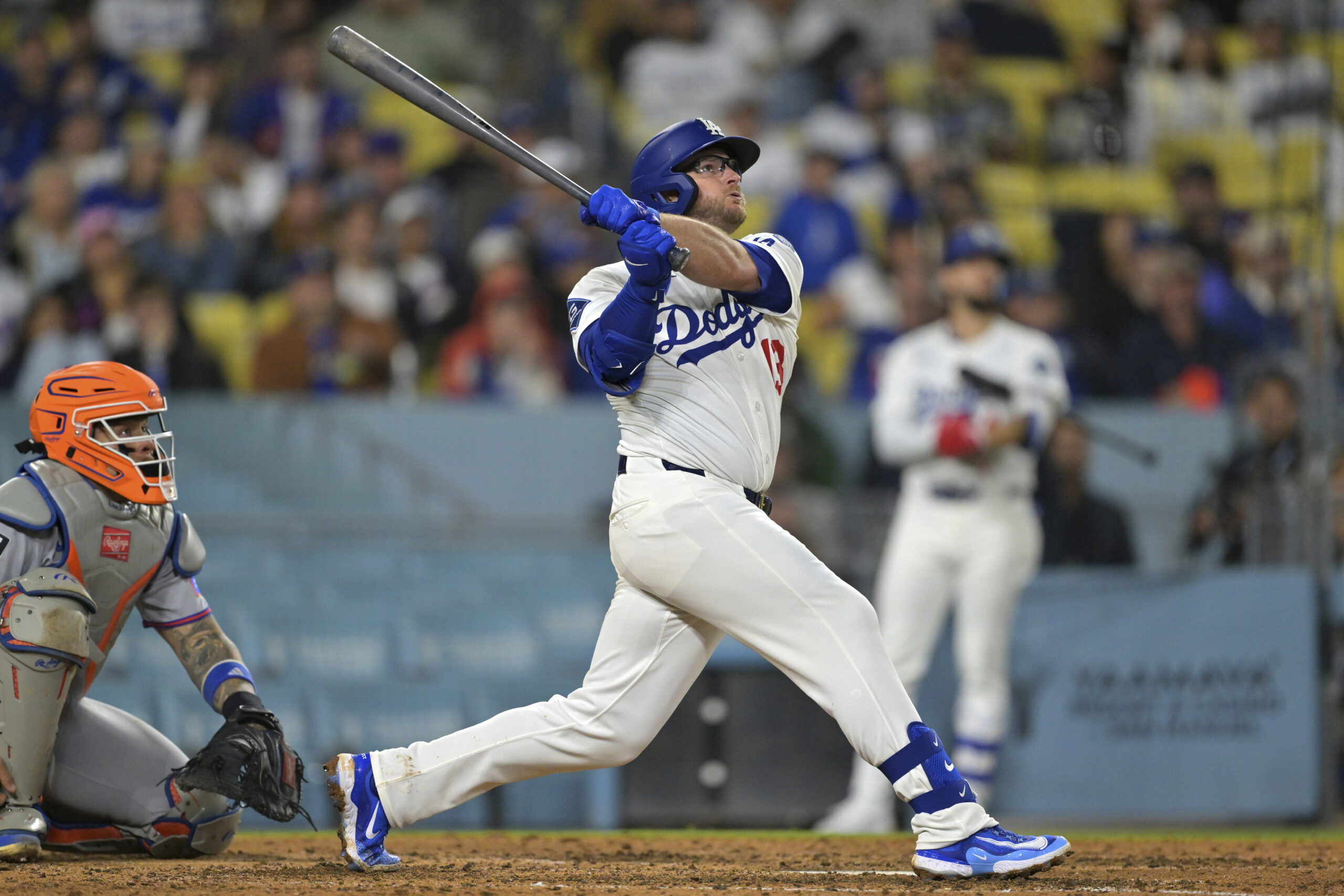The Dodgers’ Max Muncy hits a solo home run to...