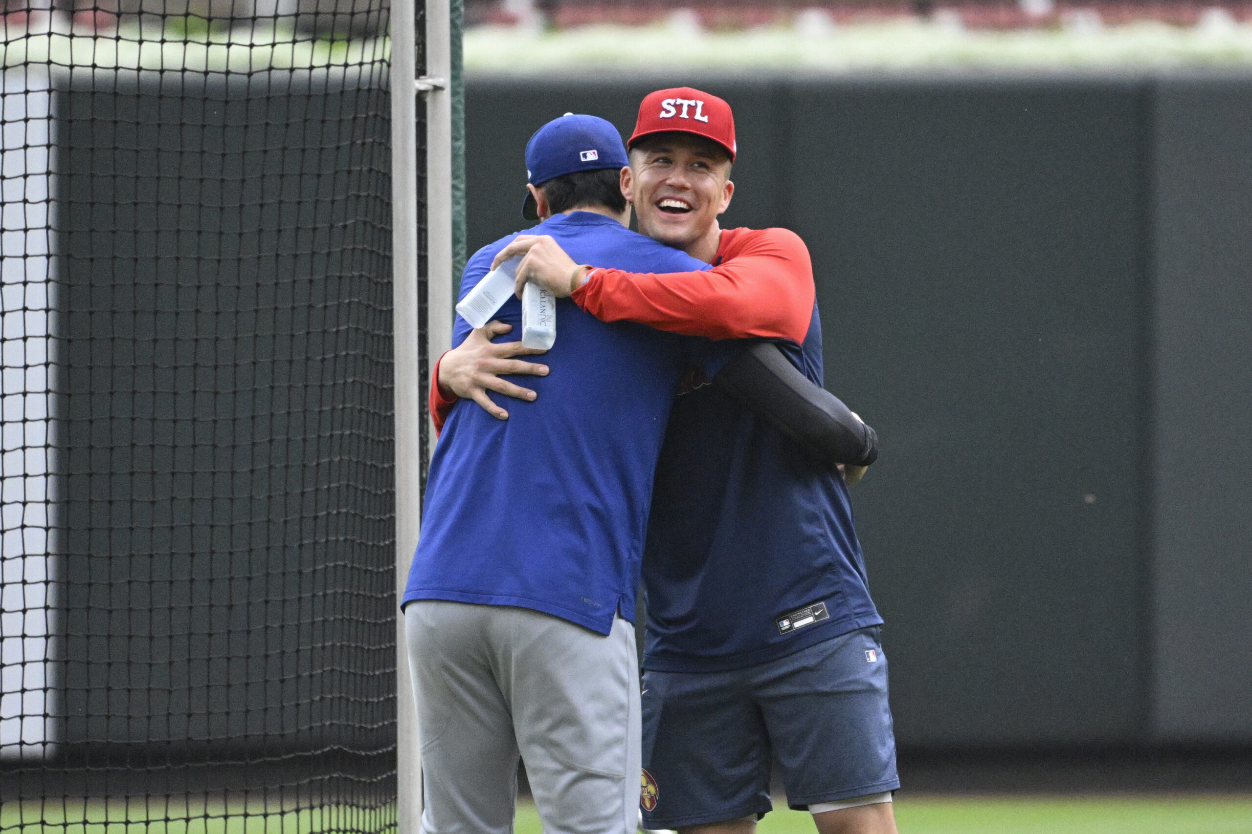 Dodgers star Shohei Ohtani, left, hugs the St. Louis Cardinals’...