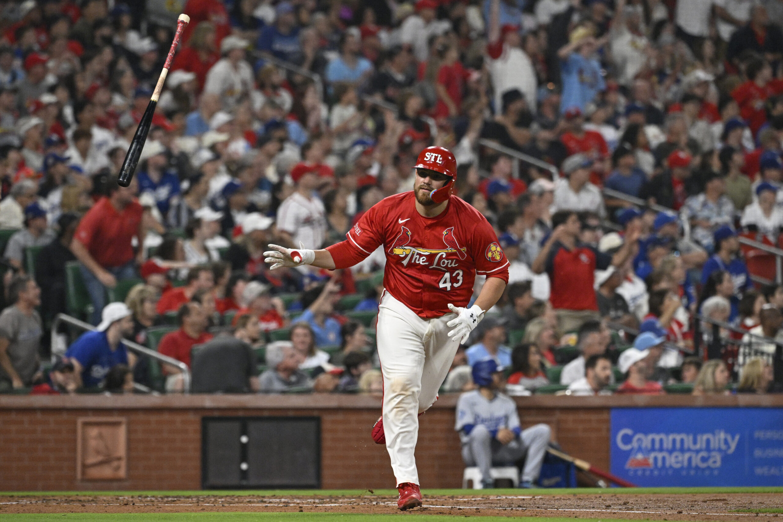The St. Louis Cardinals’ Pedro Pages tosses his bat after...
