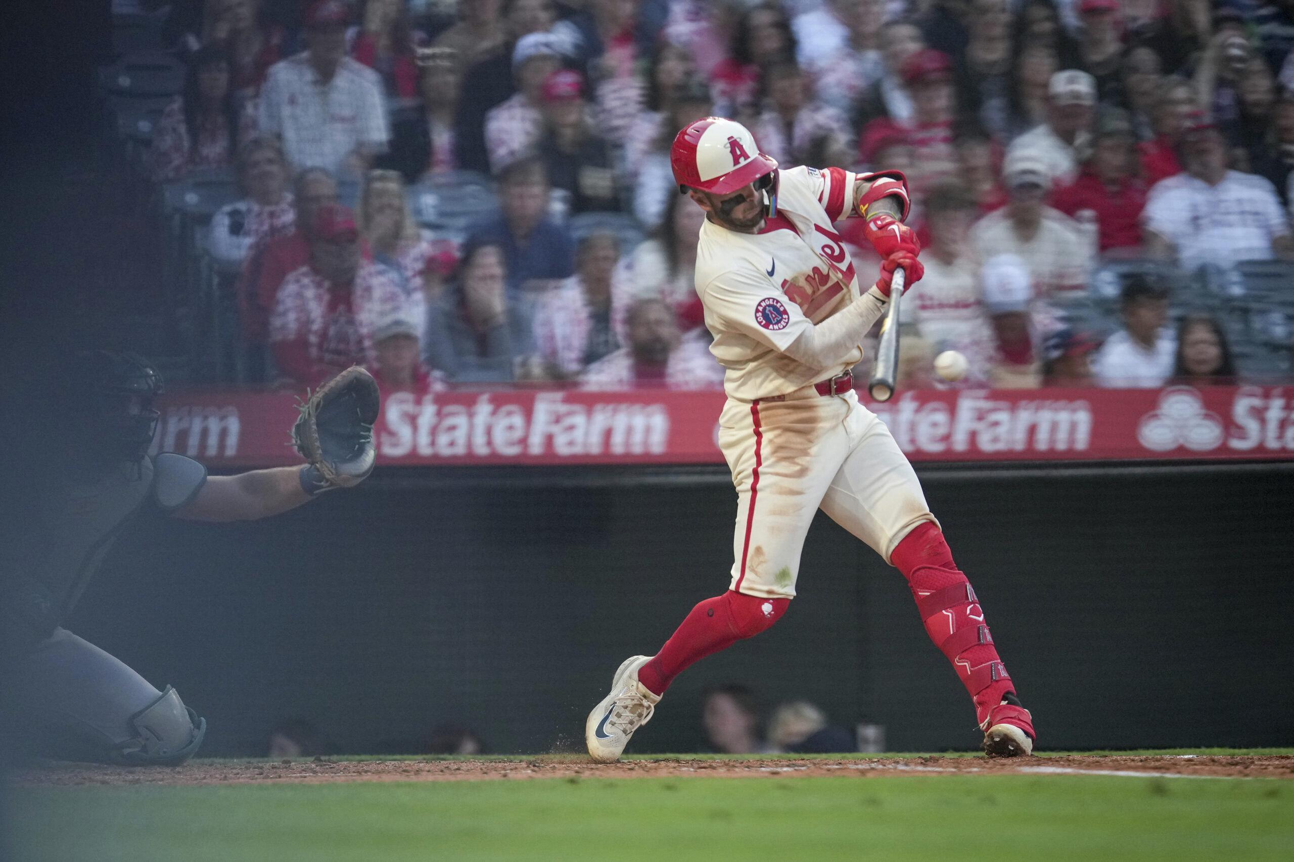 The Angels’ Zach Neto makes contact with the ball during...