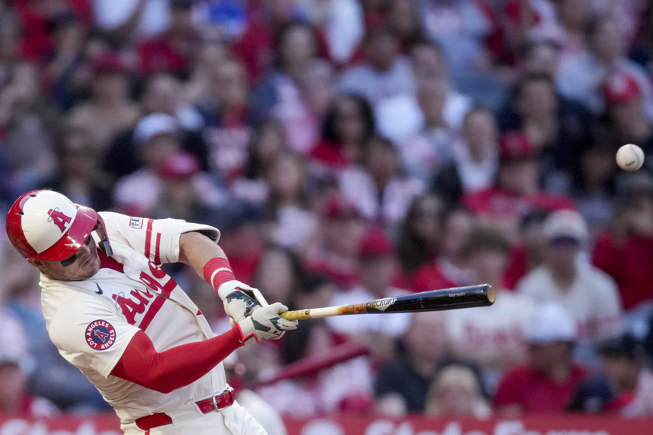 Angels designated hitter Mike Trout makes contact with the ball...