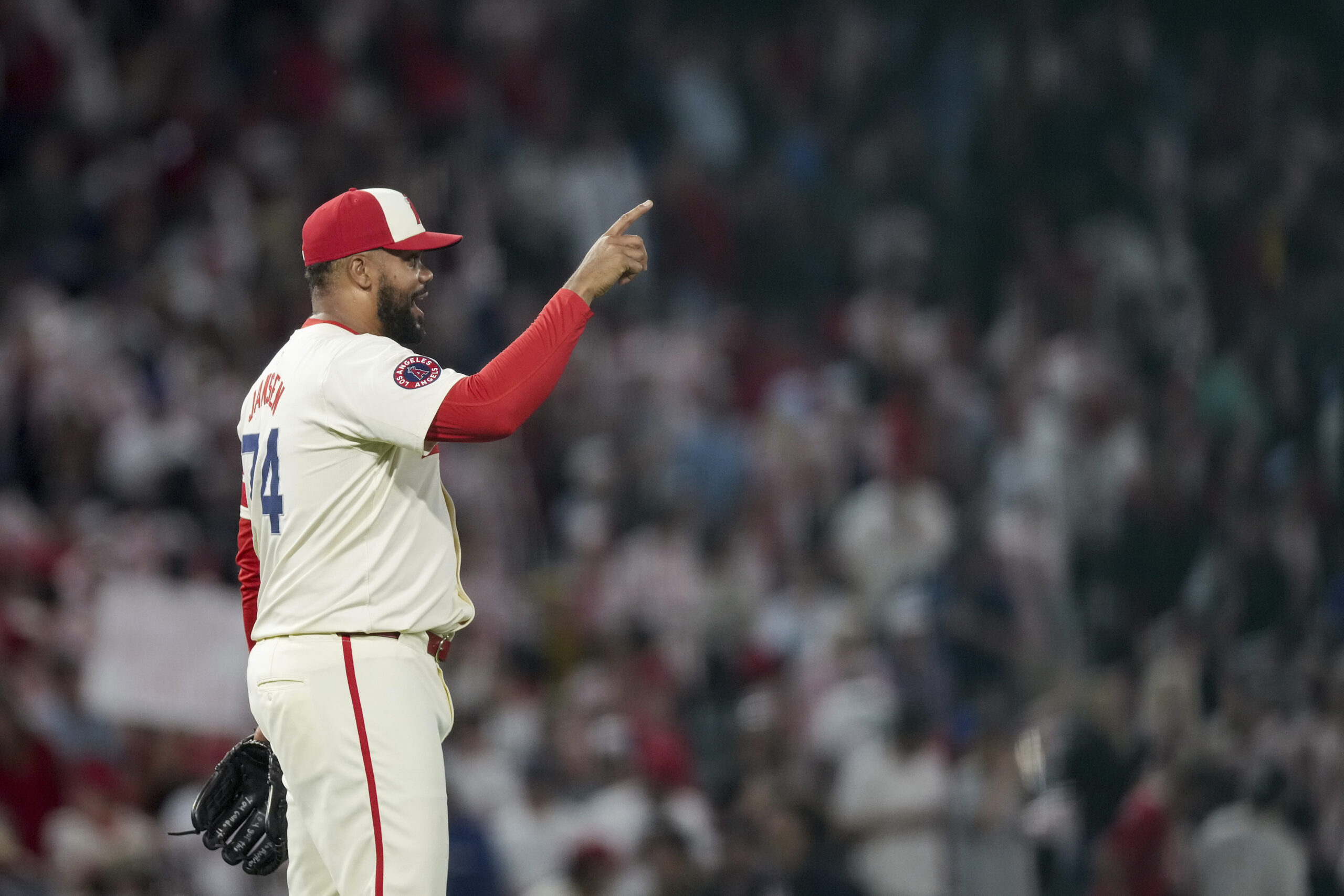 Angels relief pitcher Kenley Jansen celebrates after the final out...