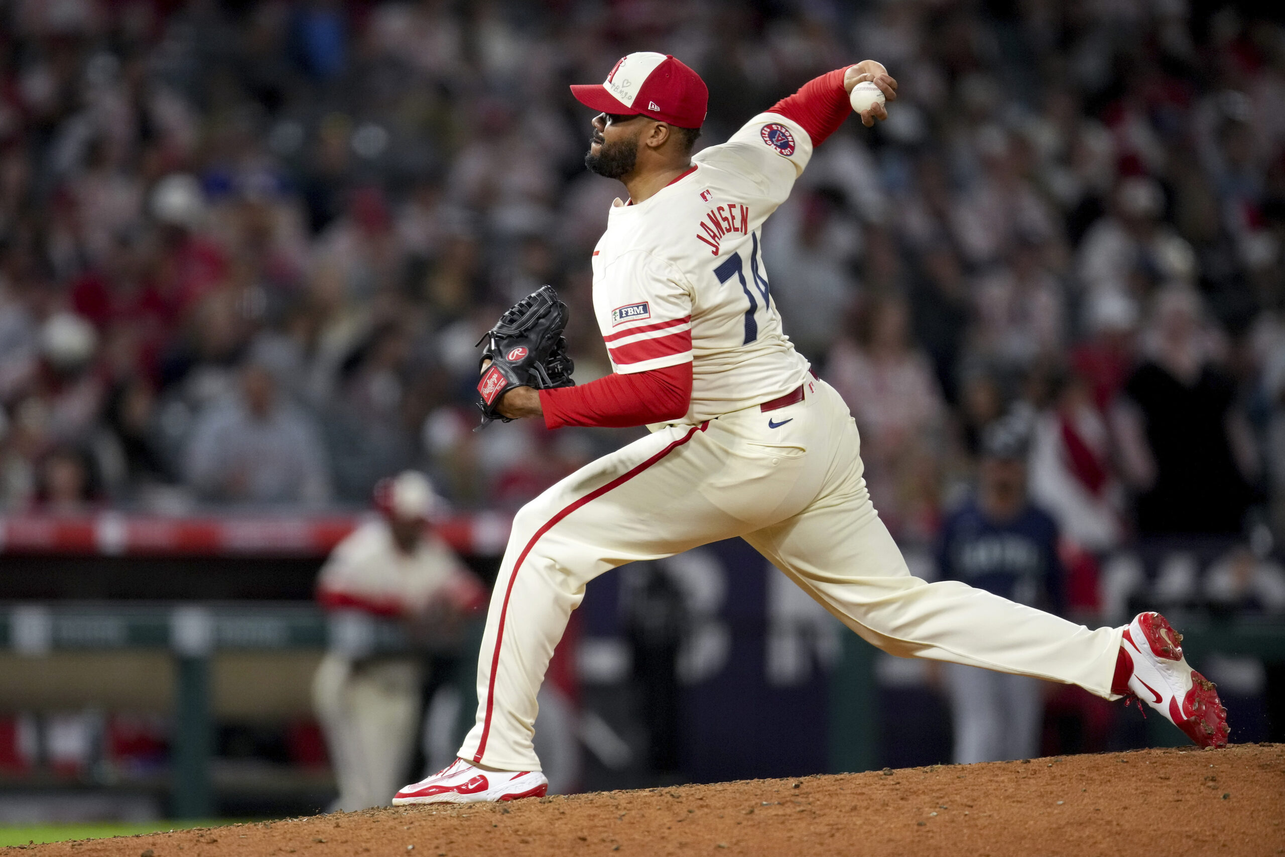 Angels relief pitcher Kenley Jansen delivers during the ninth inning...