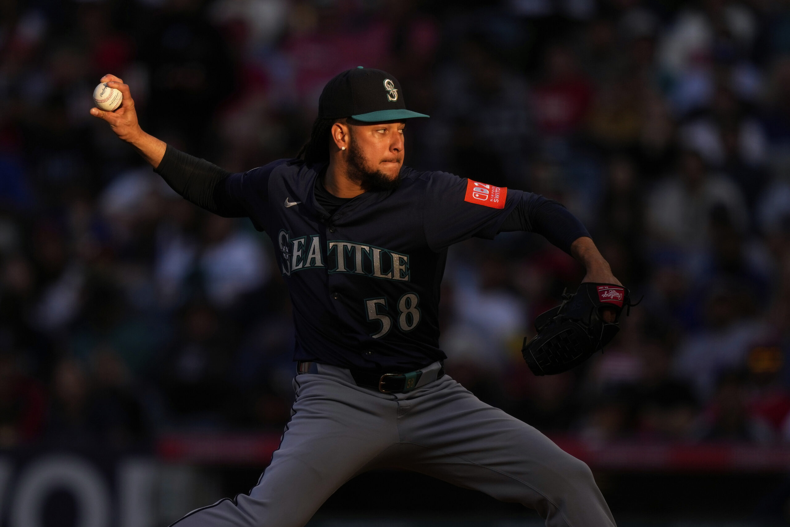 Seattle Mariners starting pitcher Luis Castillo throws to the plate...