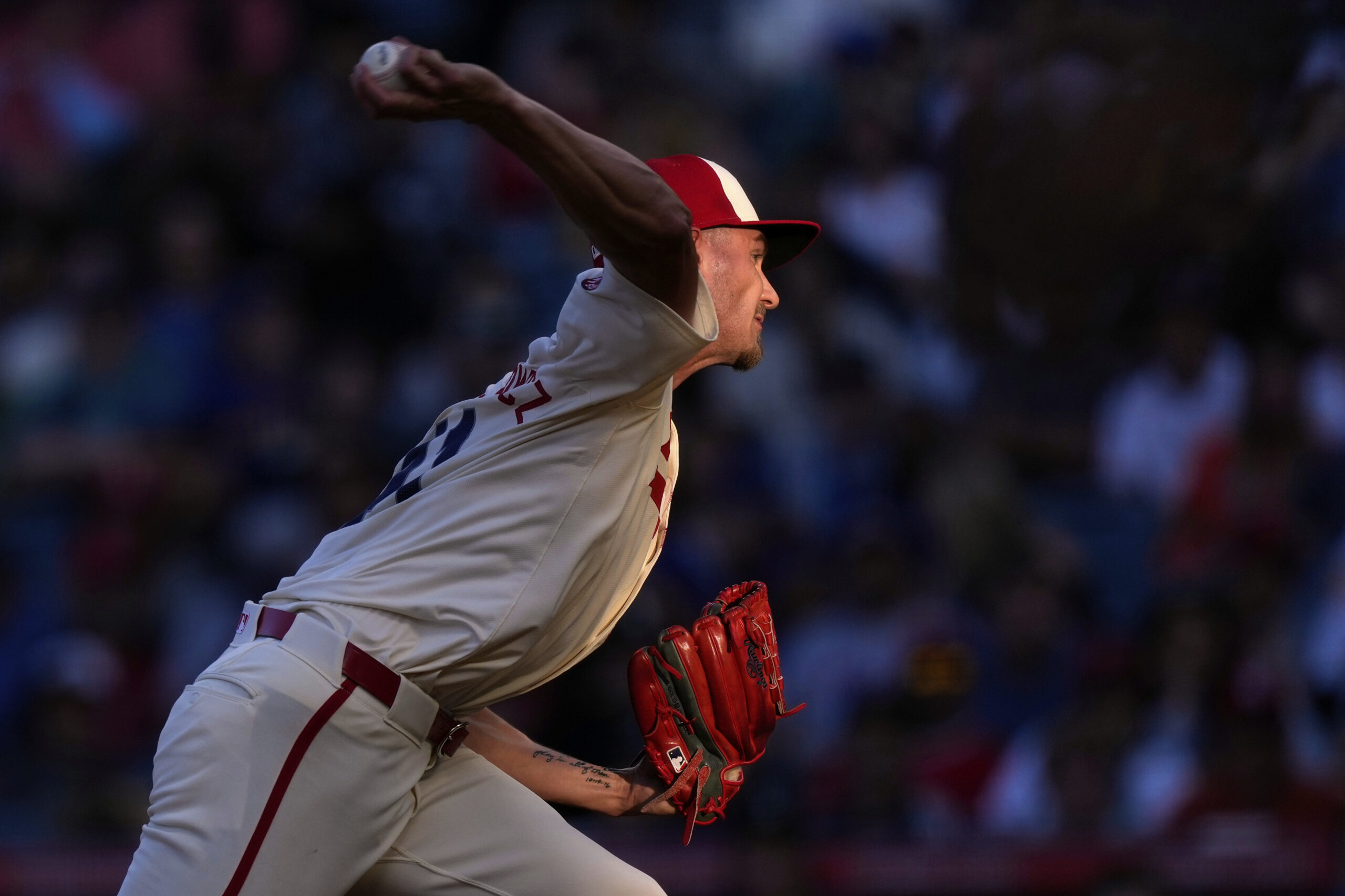 Angels starting pitcher Jack Kochanowicz throws to the plate during...