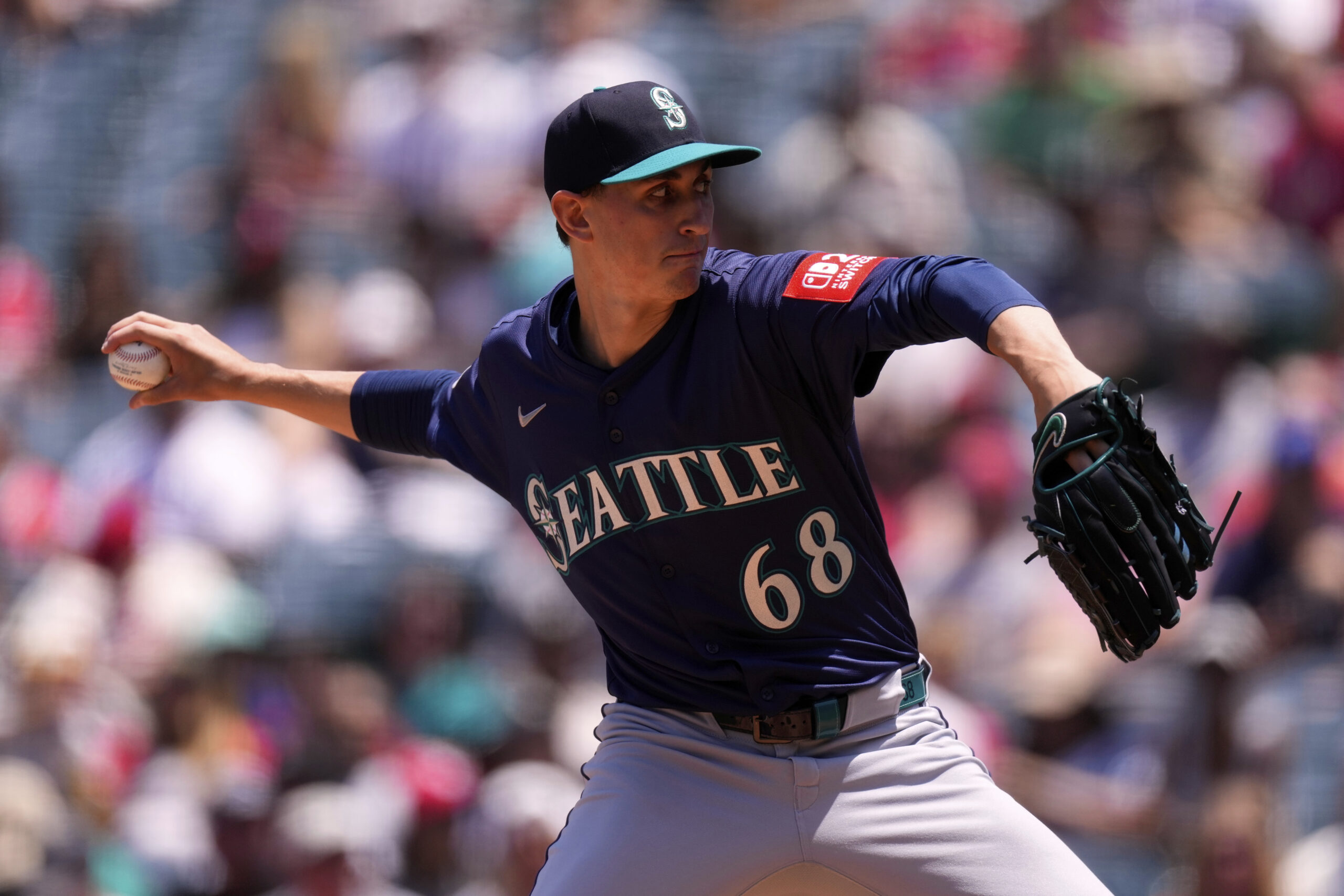 Seattle Mariners starting pitcher George Kirby throws to the plate...