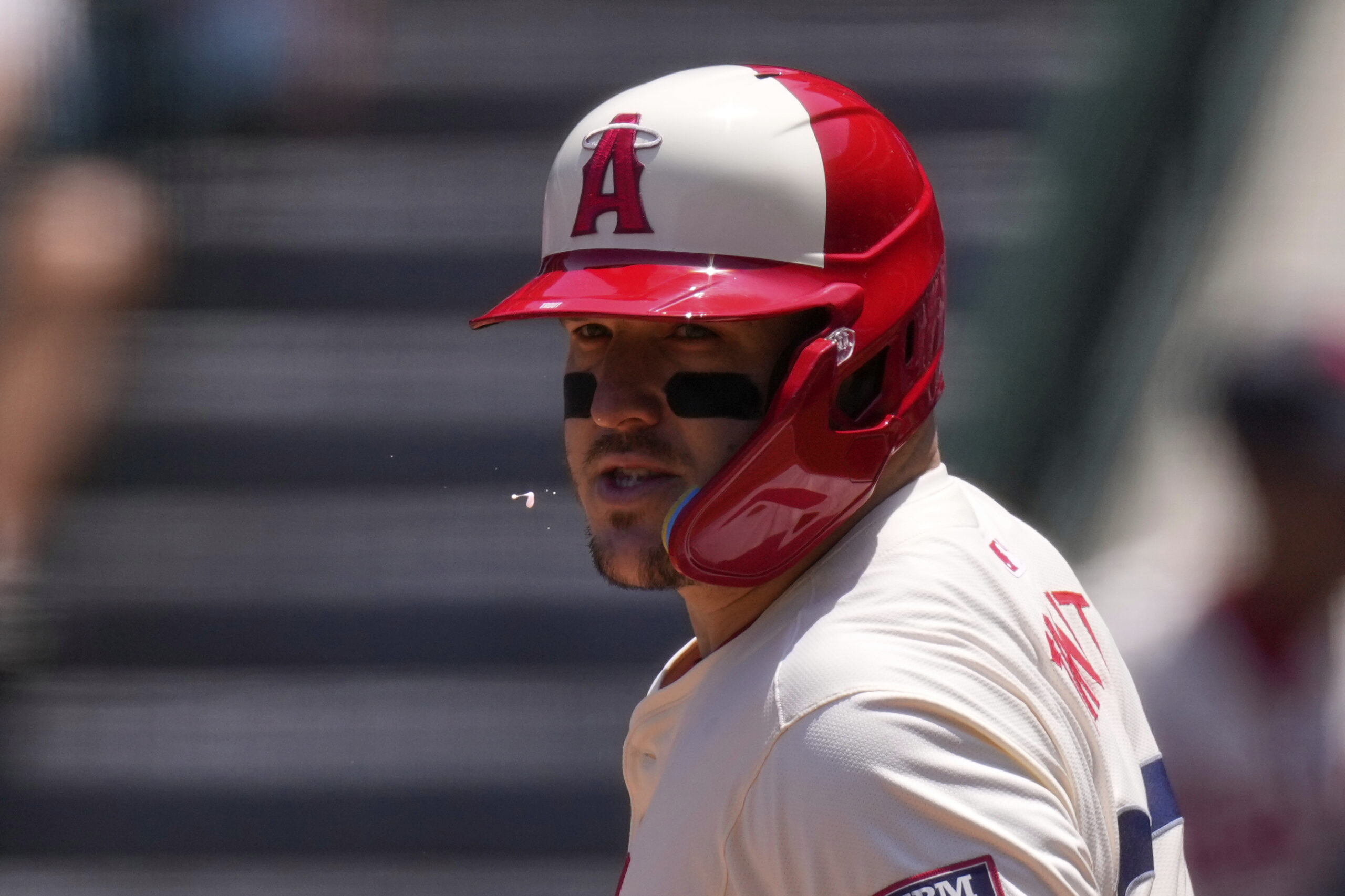 Angels’ Mike Trout spits during his at-bat in the first...