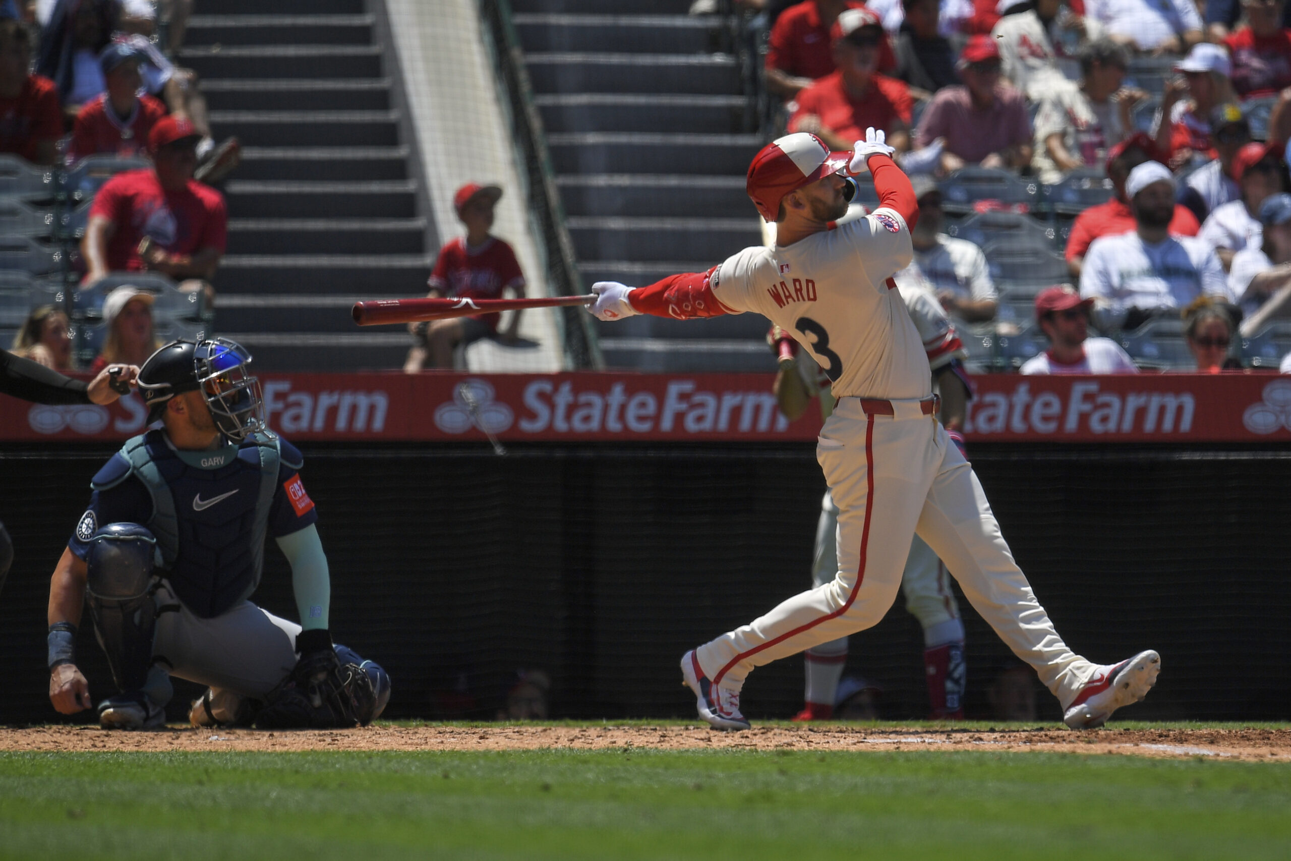 Angels’ Taylor Ward, right, hits a two-run home run as...