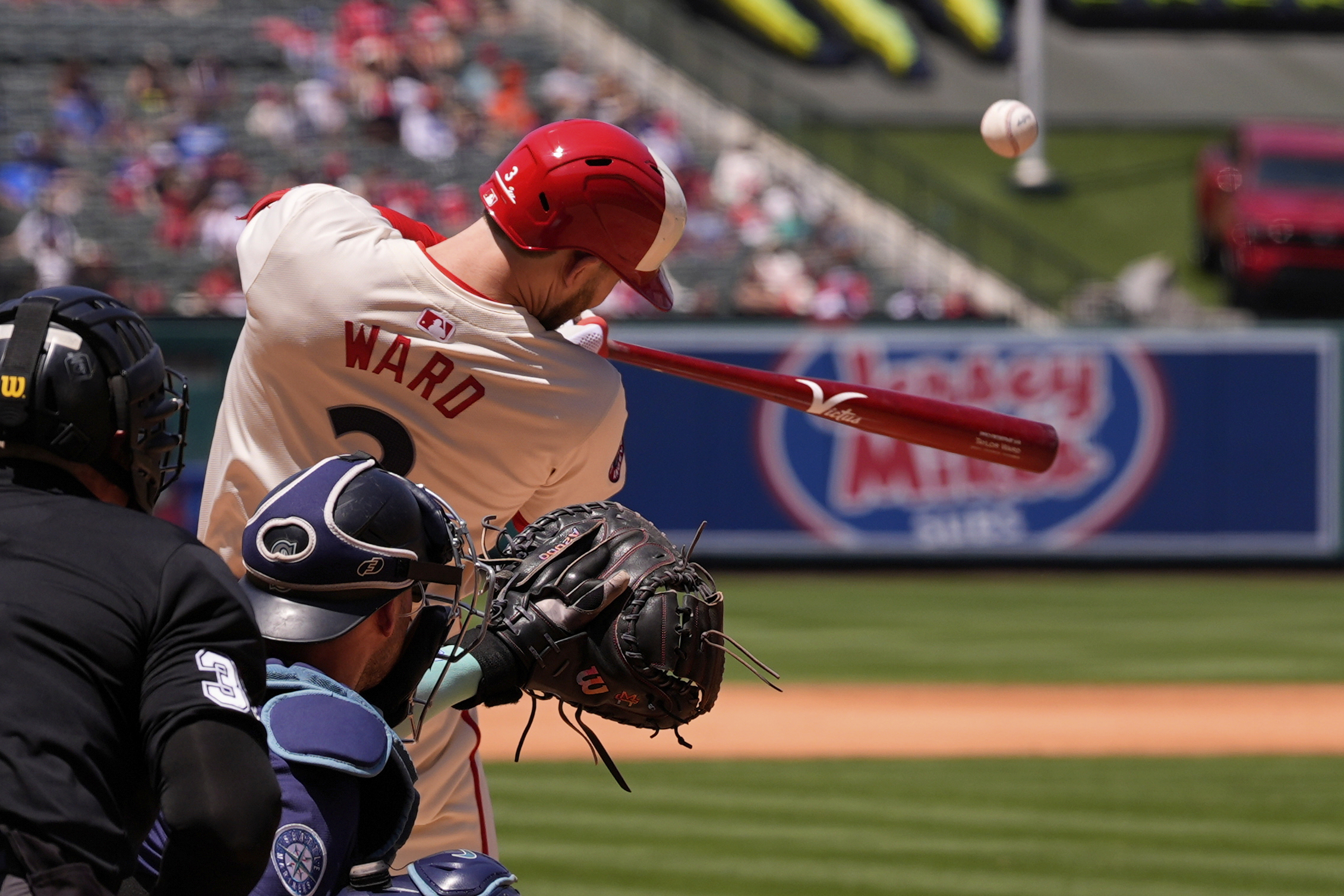 Angels’ Taylor Ward, right, hits a two-run home run as...