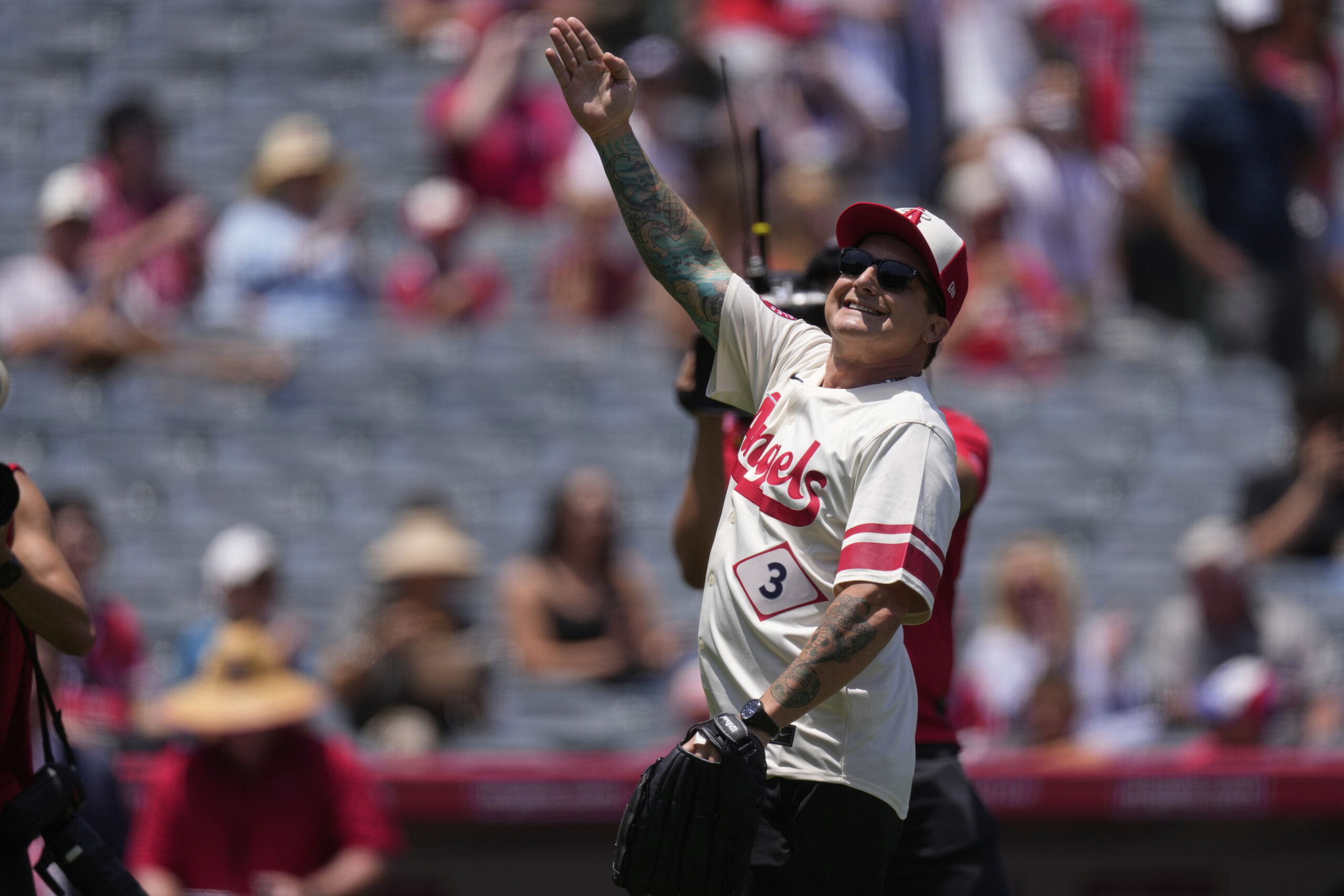 Tré Cool, drummer for the rock band Green Day, gestures...