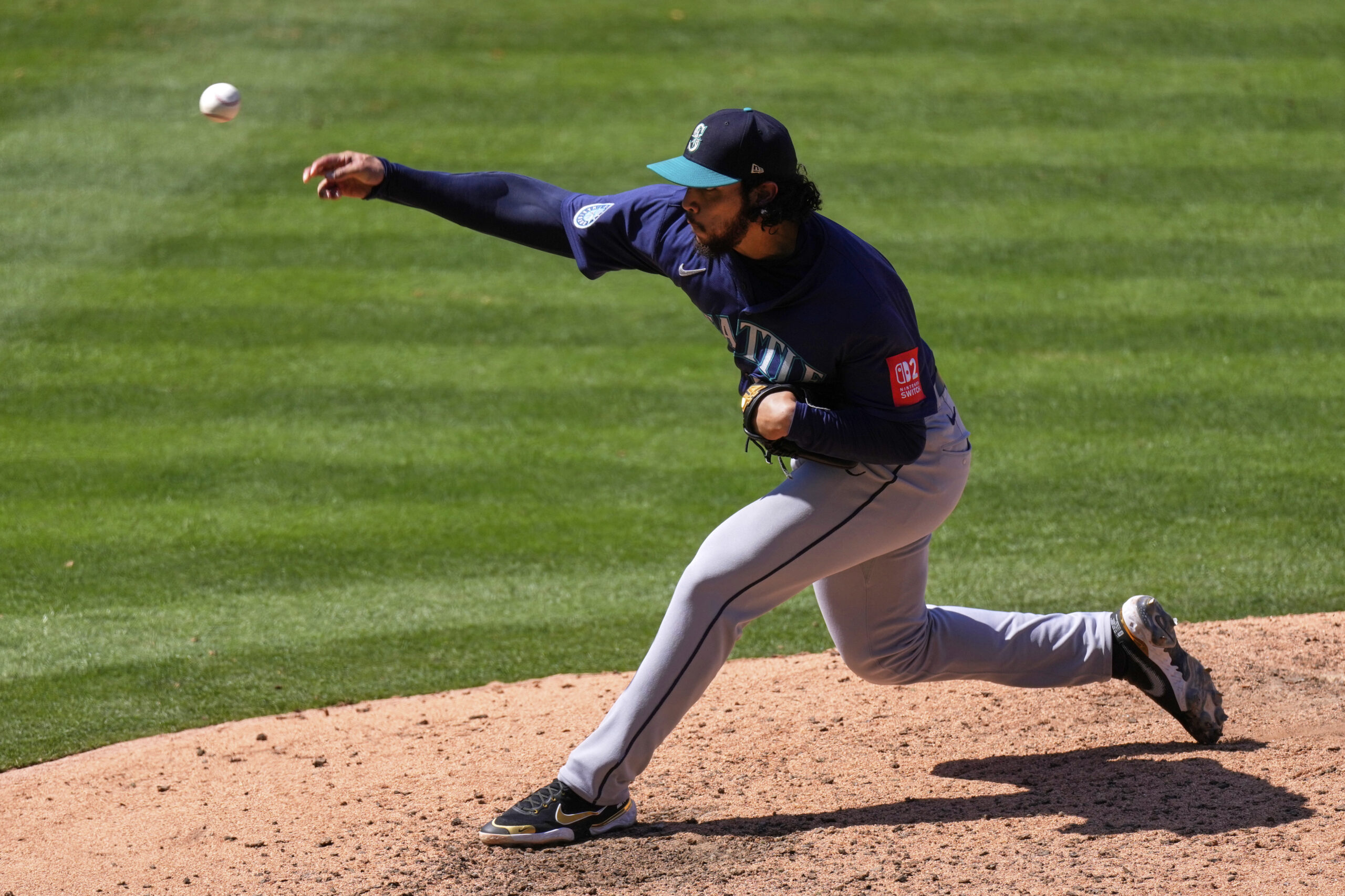 Seattle Mariners relief pitcher Andres Munoz throws to the plate...