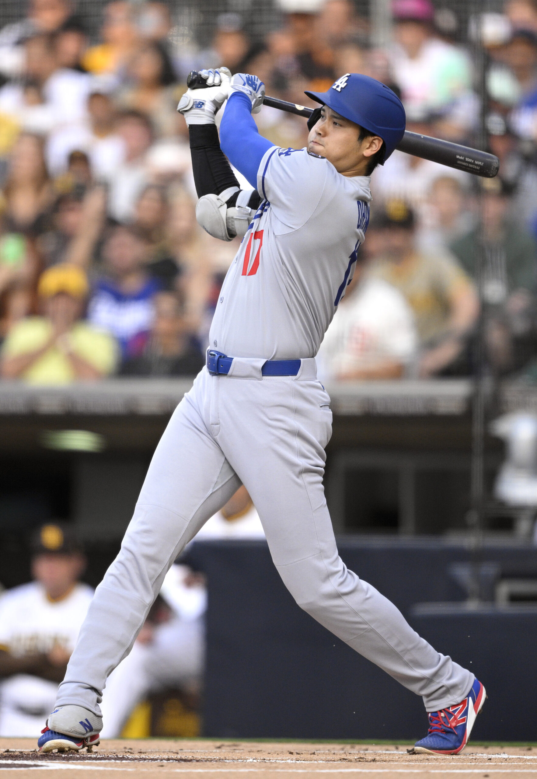 Dodgers star Shohei Ohtani hits a double against the San...