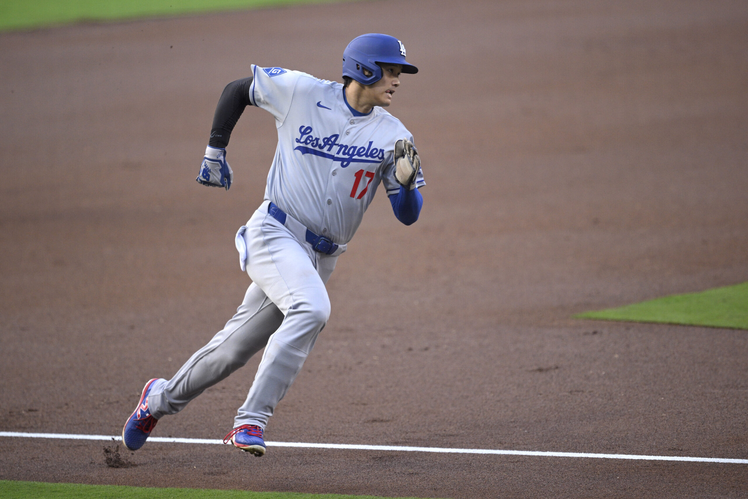 Dodgers star Shohei Ohtani rounds third base before scoring on...