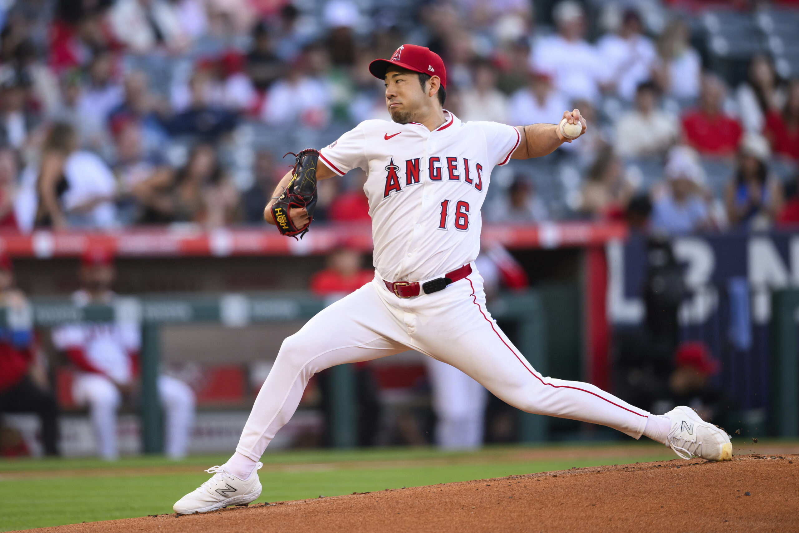 Angels starting pitcher Yusei Kikuchi throws to the plate during...