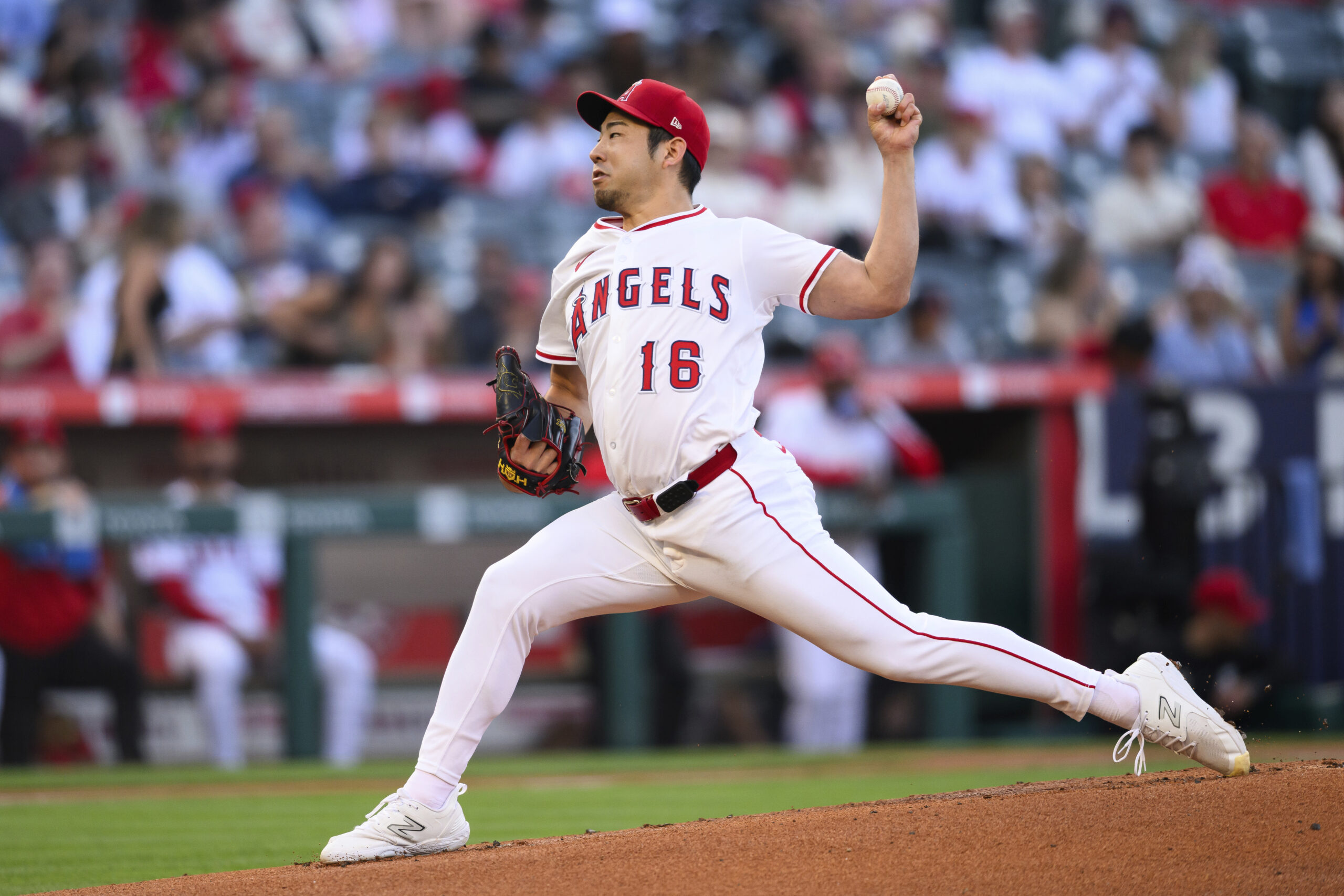 Angels starting pitcher Yusei Kikuchi throws to the plate during...