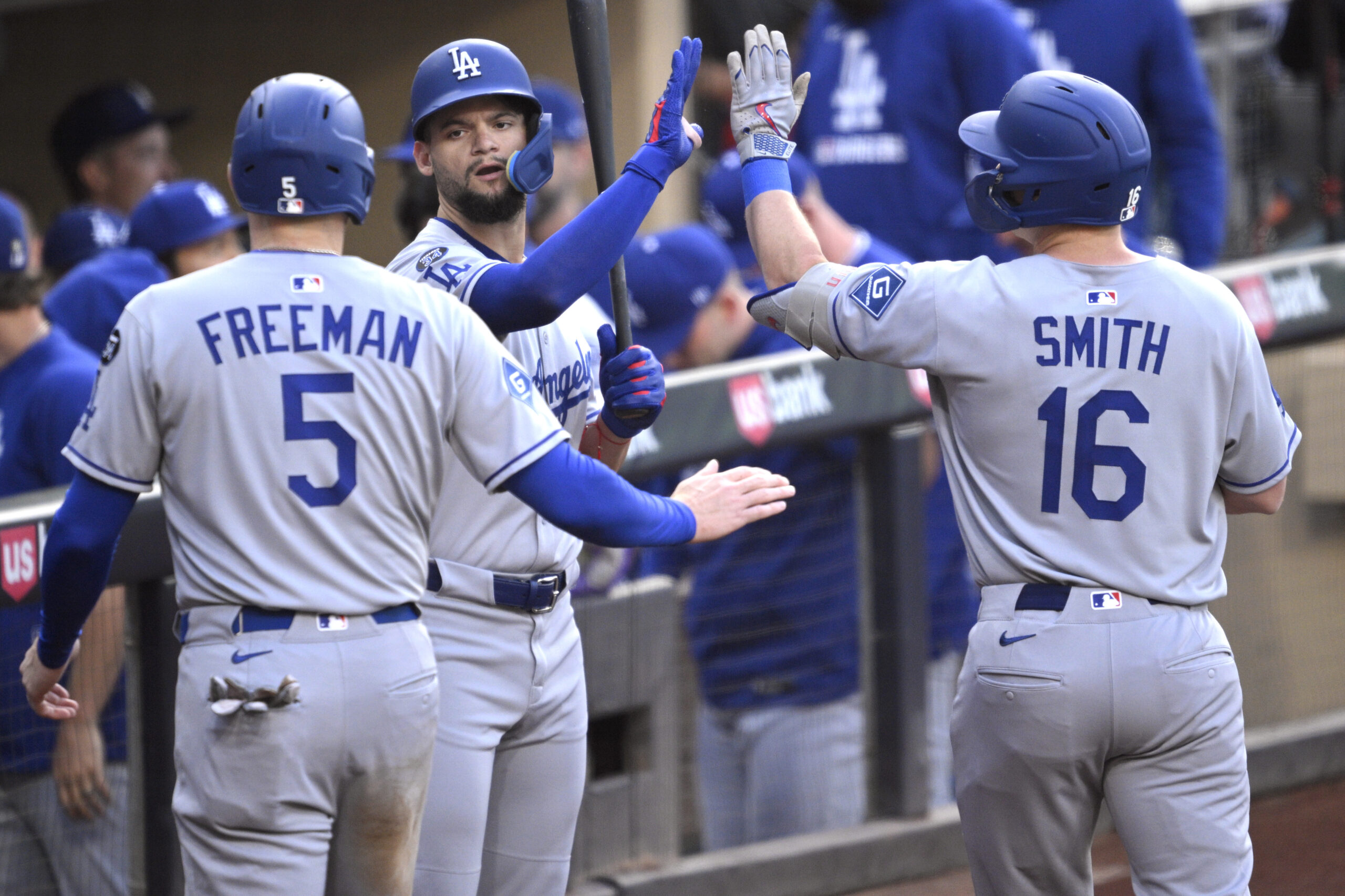 The Dodgers’ Will Smith, right, is congratulated by teammate Andy...