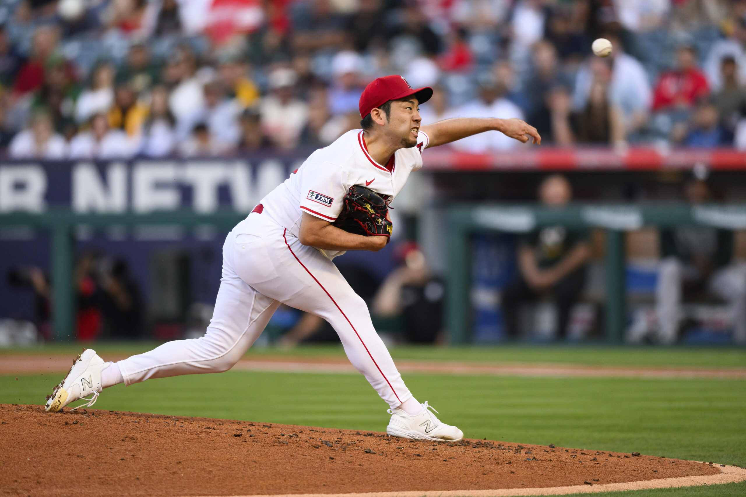 Angels starting pitcher Yusei Kikuchi throws to the plate during...
