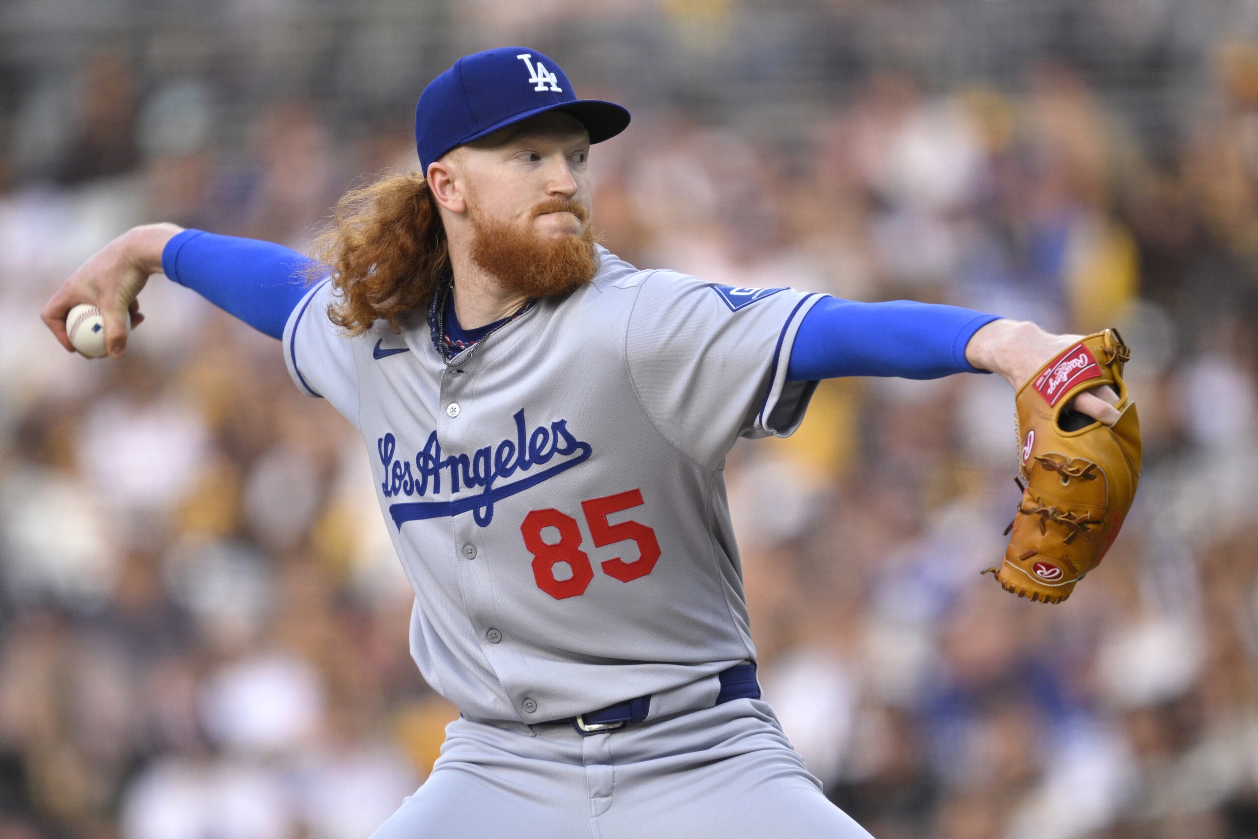 Dodgers starting pitcher Dustin May throws to the plate against...