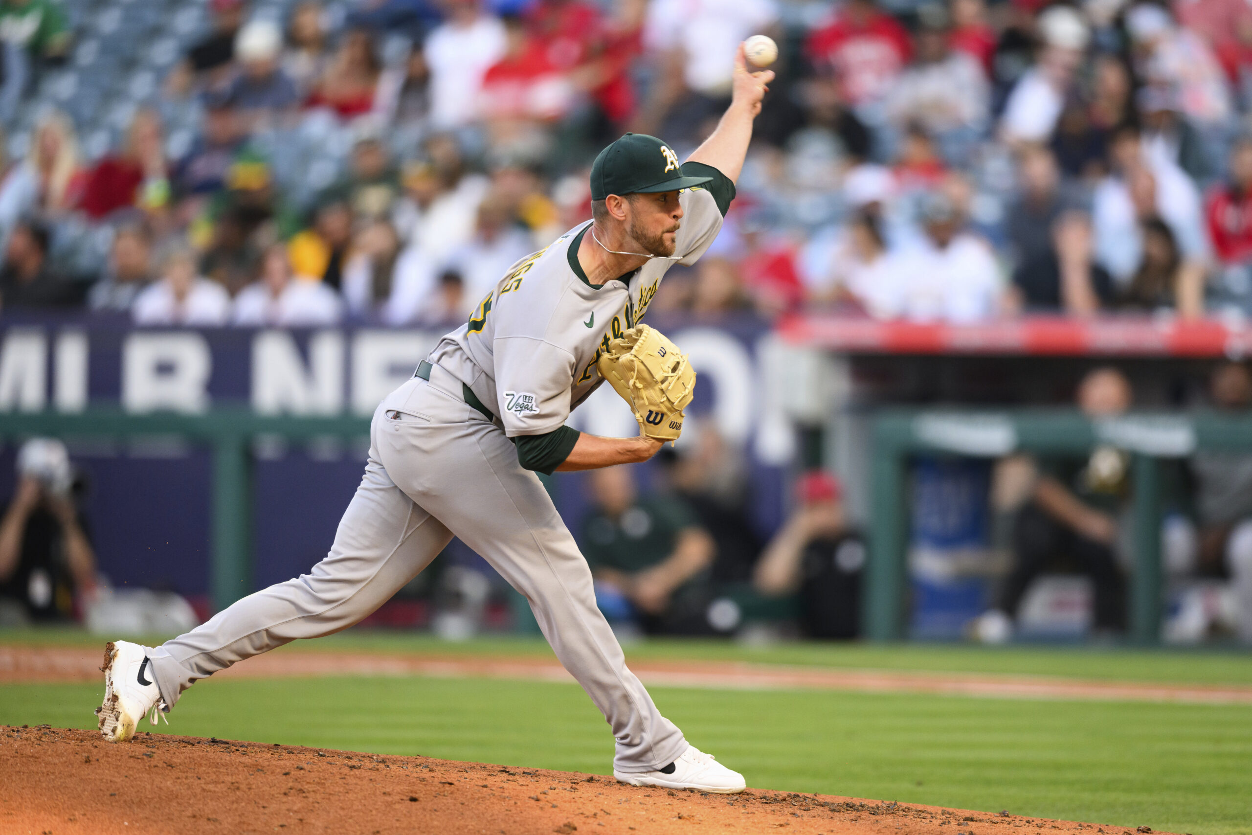 Athletics starting pitcher Jeffrey Springs delivers to the plate during...