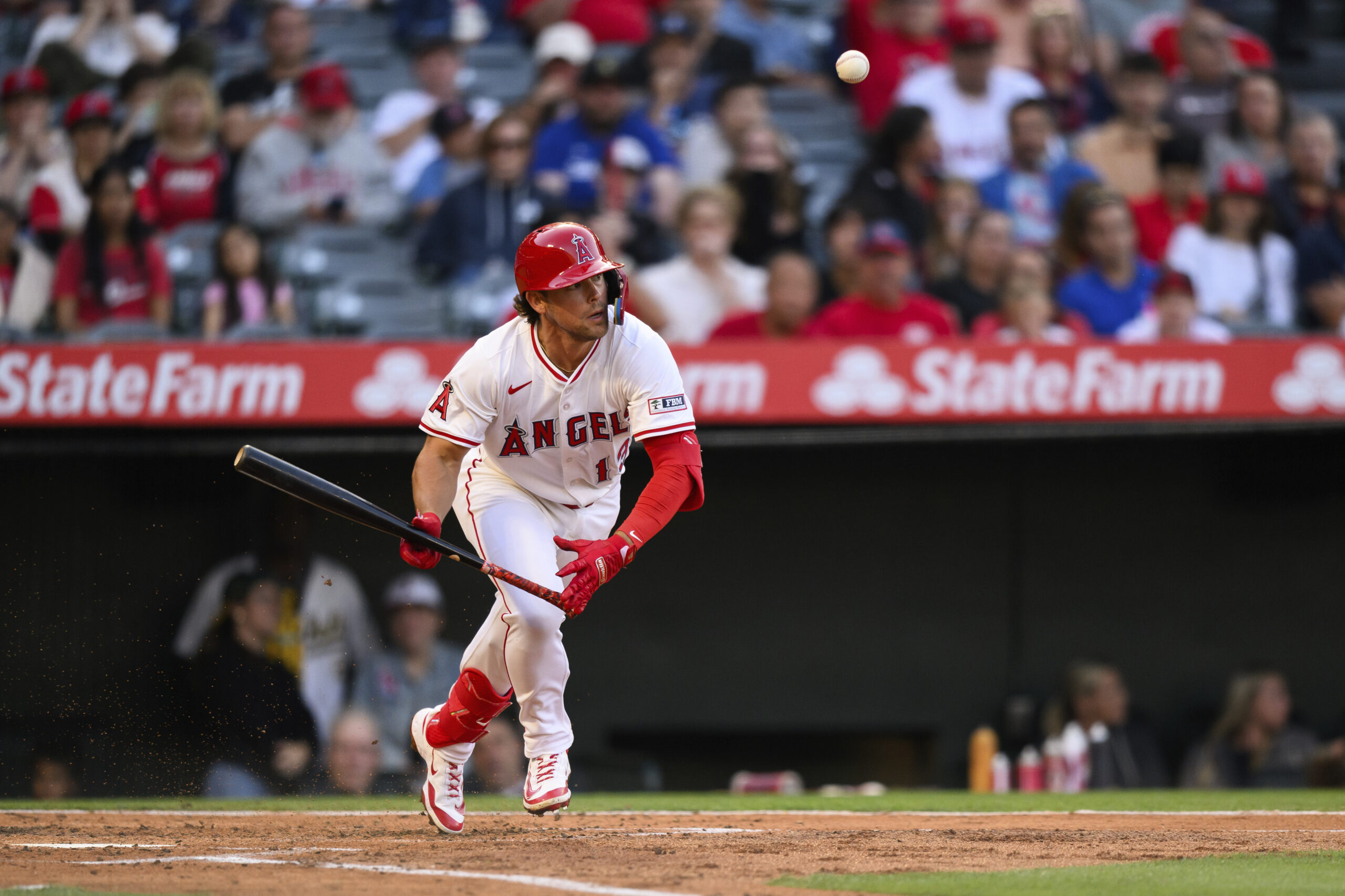 The Angels’ Scott Kingery bunts the ball during the third...