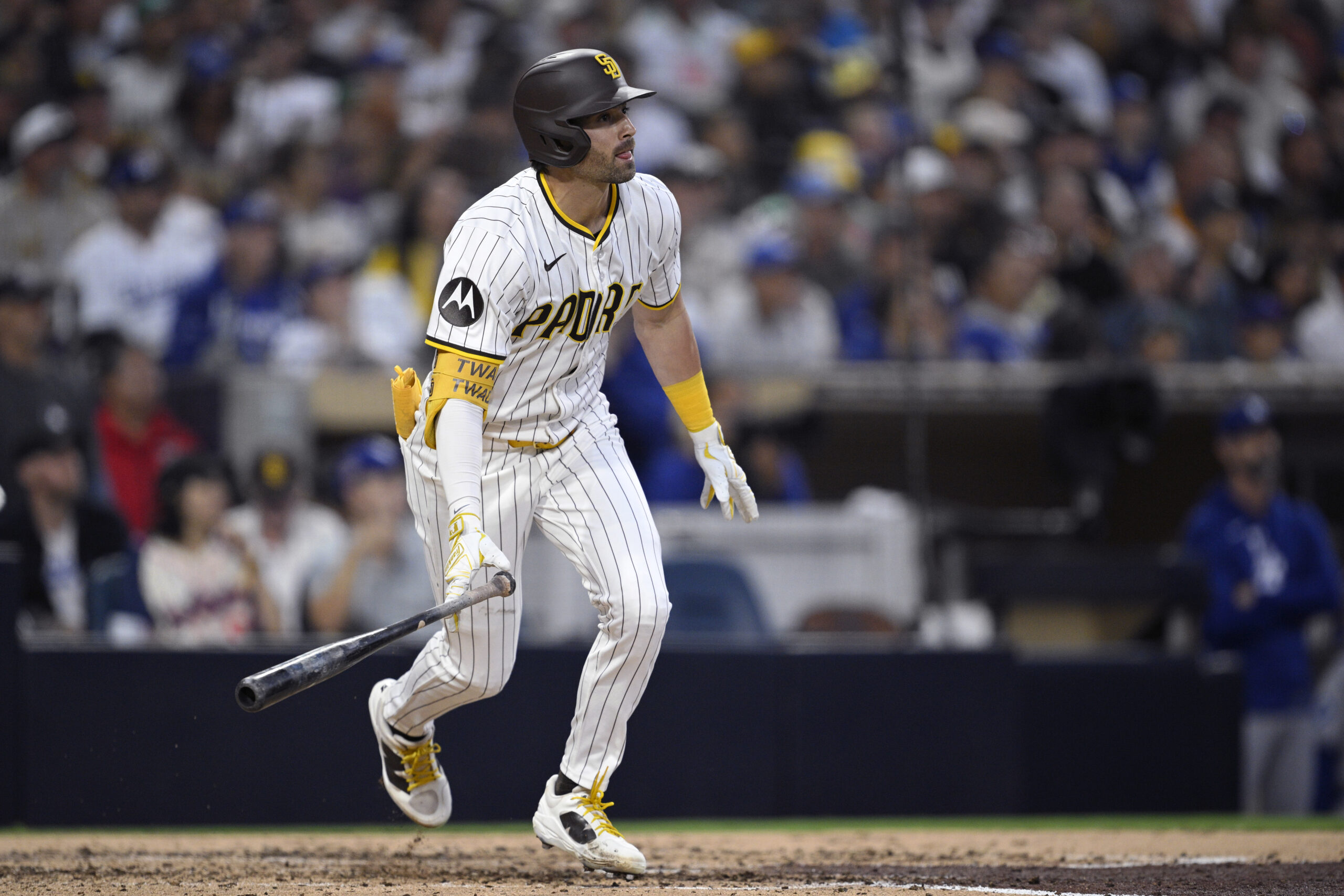 The San Diego Padres’ Tyler Wade hits a three-run triple...