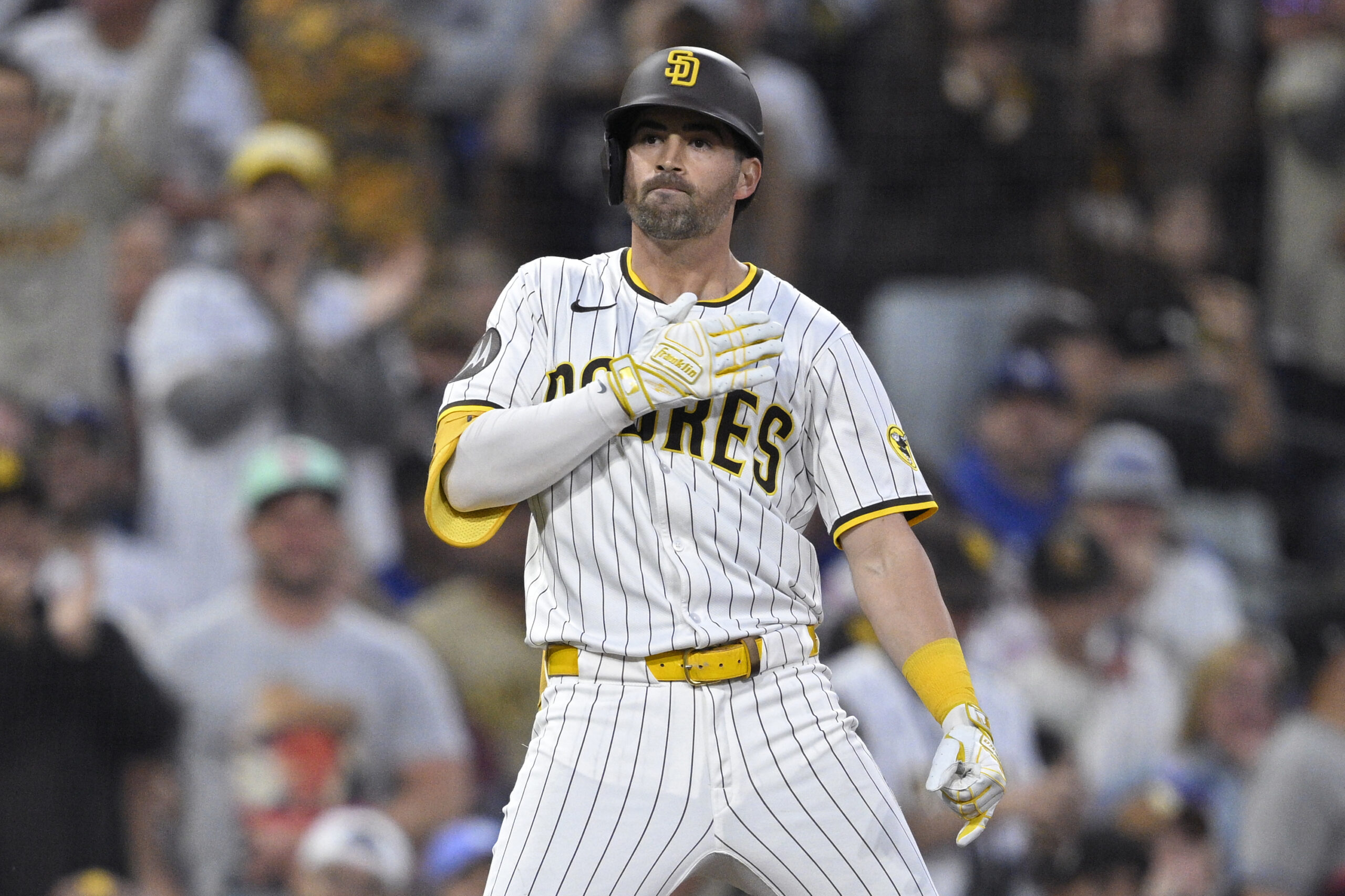 The San Diego Padres’ Tyler Wade celebrates after hitting a...