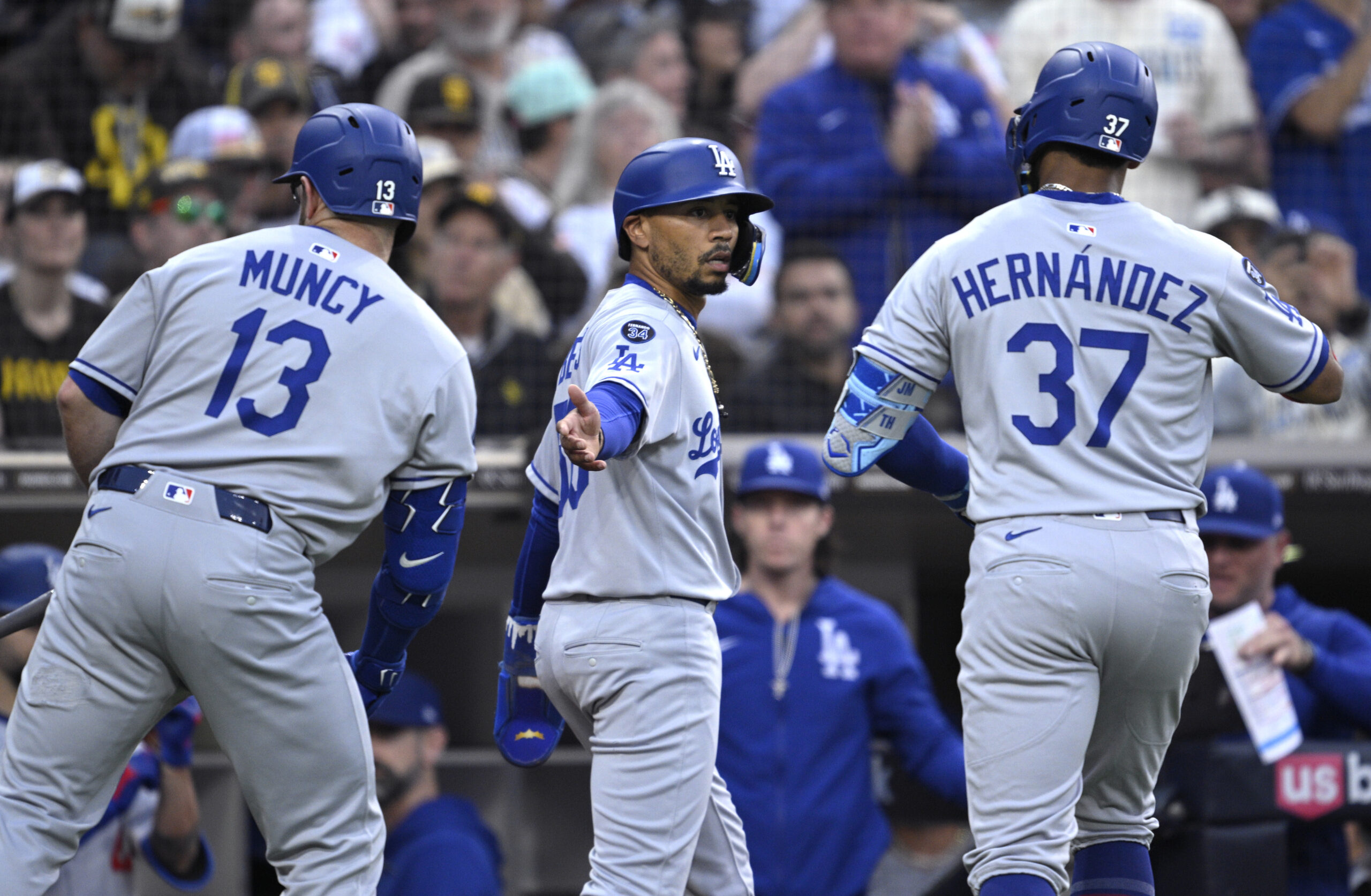 The Dodgers’ Teoscar Hernandez, right, is congratulated by teammate Mookie...