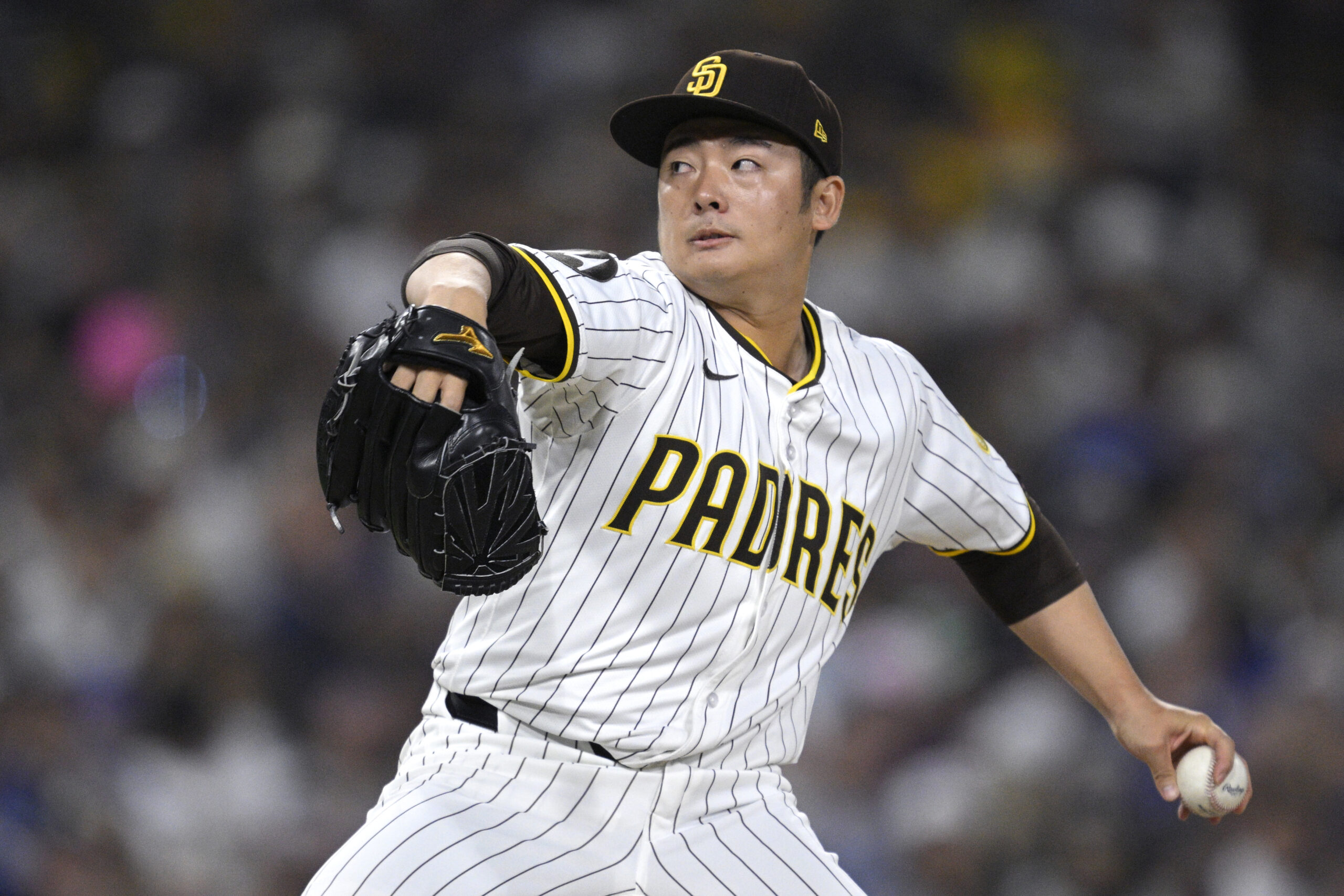 San Diego Padres relief pitcher Yuki Matsui throws to the...