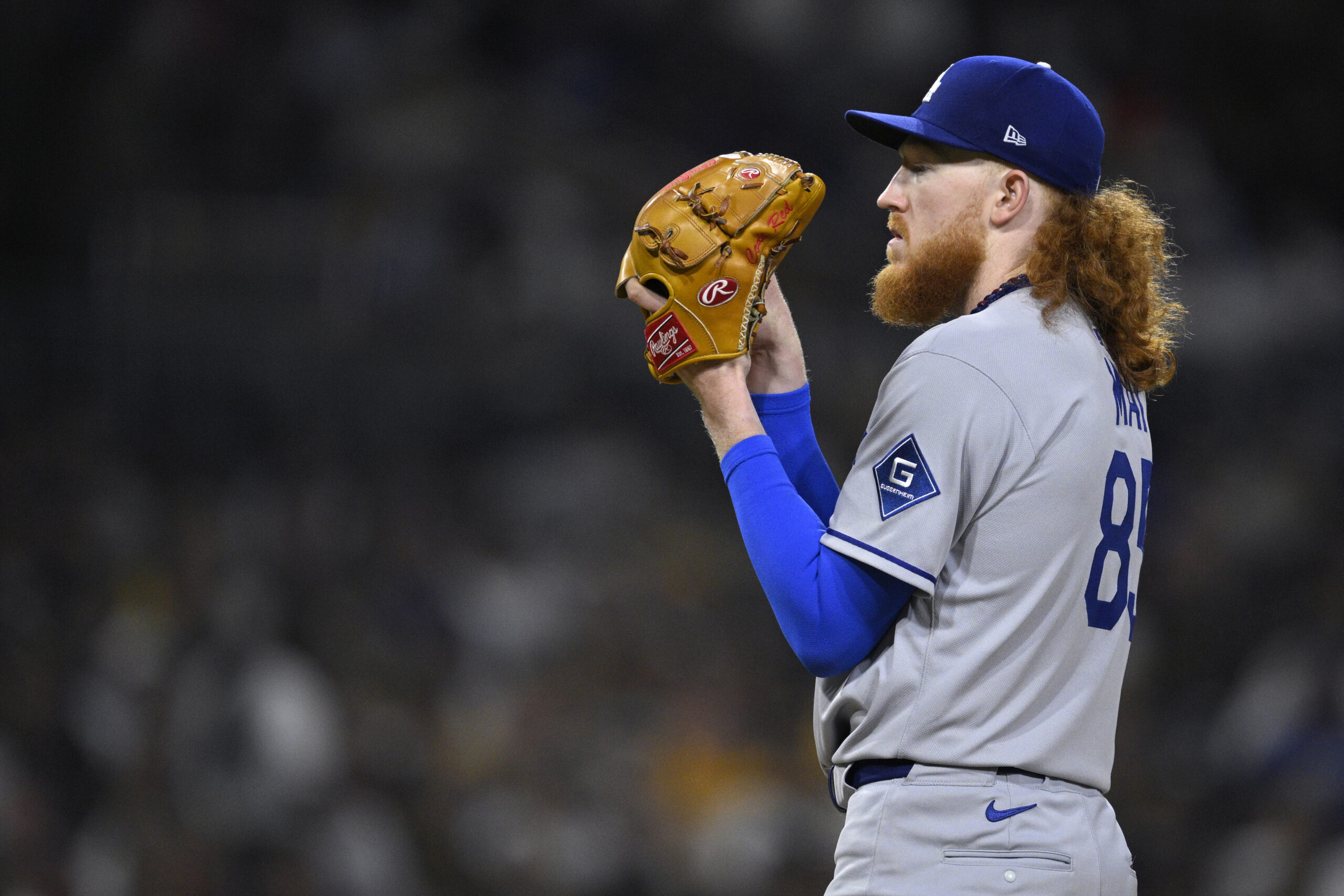 Dodgers starting pitcher Dustin May prepares to throw to the...