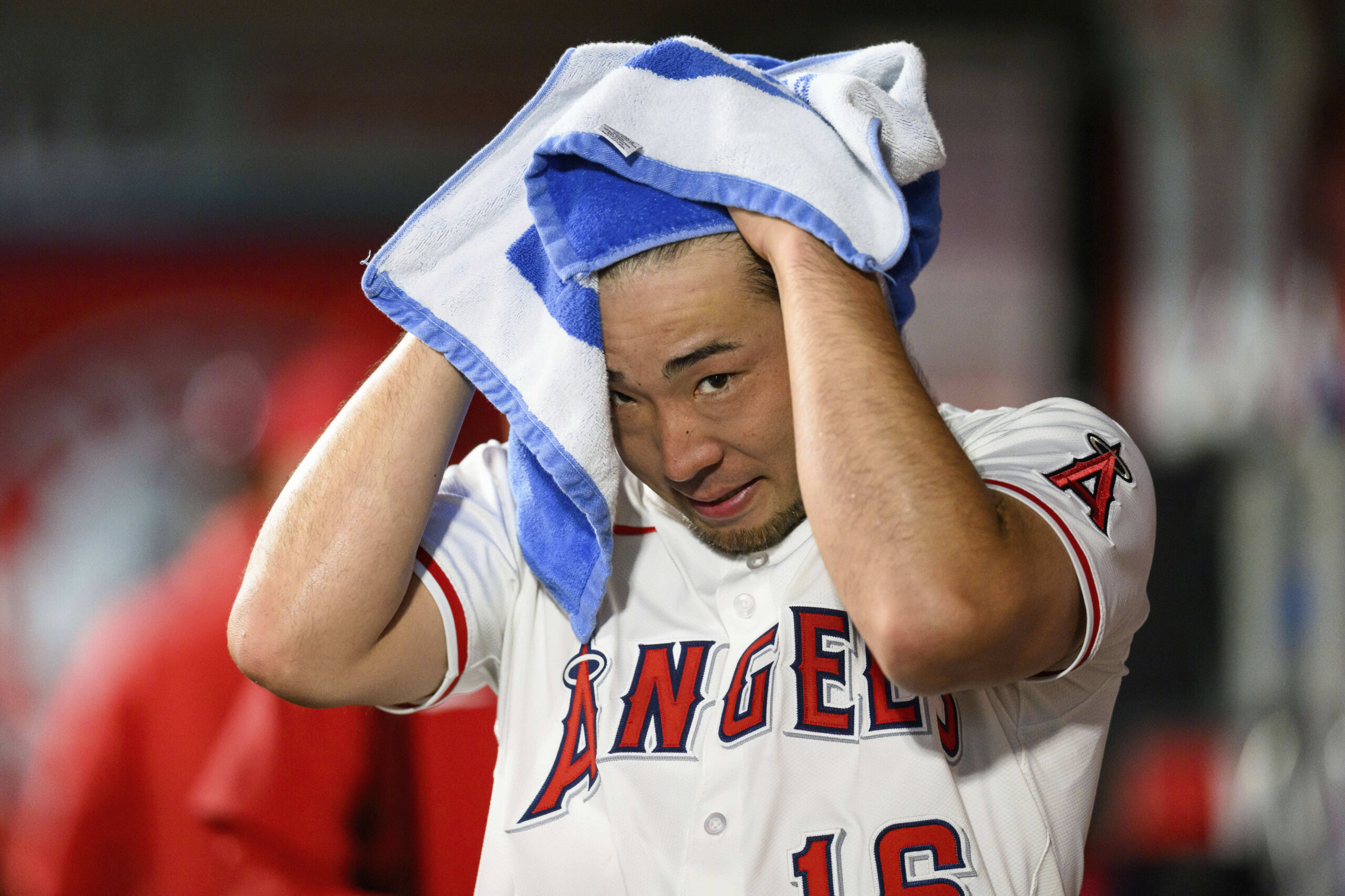 Angels starting pitcher Yusei Kikuchi looks on after being substituted...