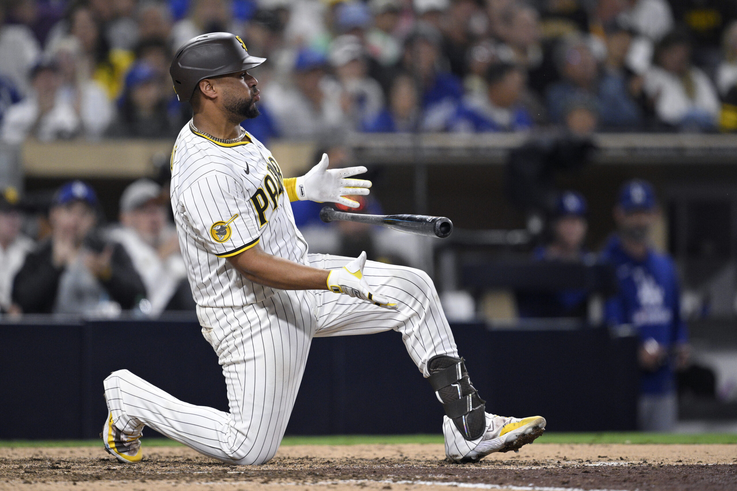The San Diego Padres’ Elias Diaz reacts after striking out...