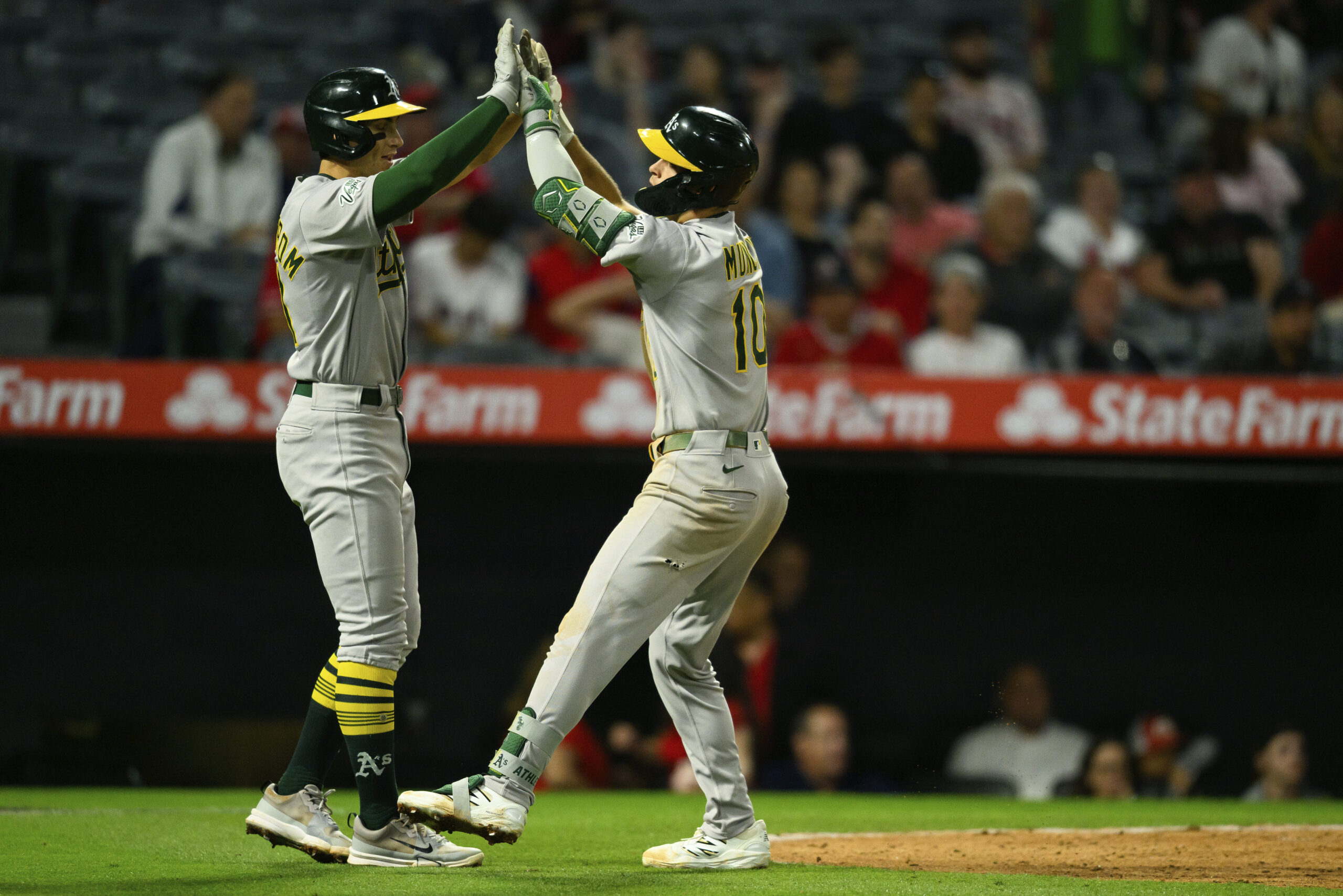The Athletics’ Max Muncy, right, celebrates with teammate Tyler Soderstrom...