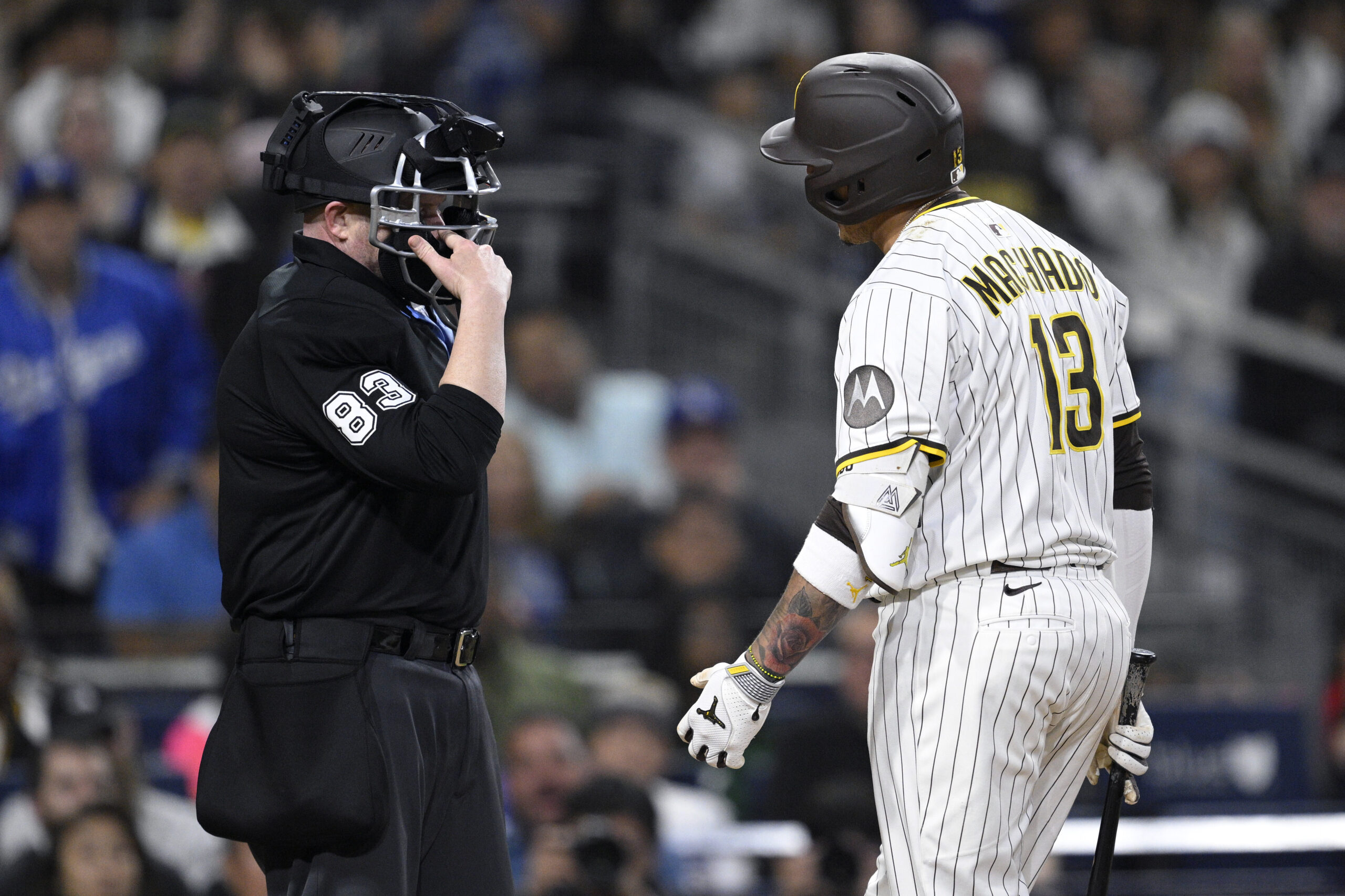 The San Diego Padres’ Manny Machado argues with home plate...